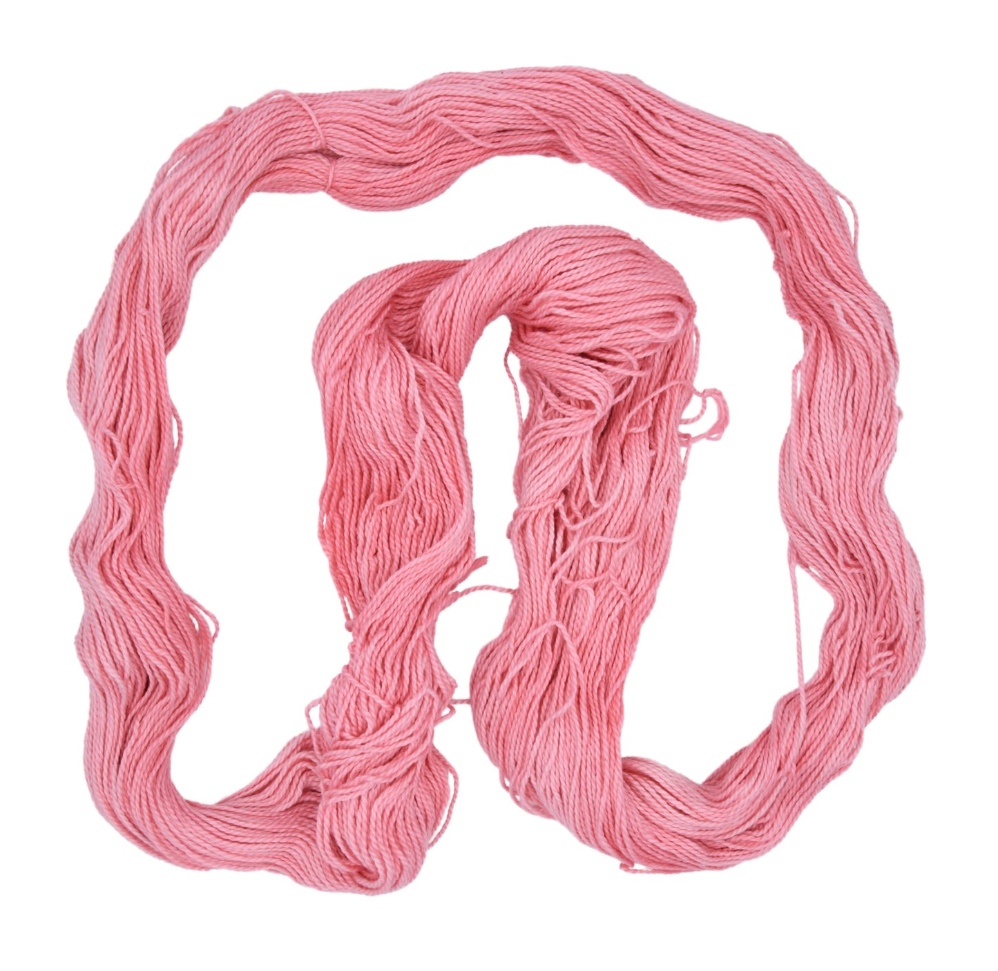 My Job is Beach yarn shown in a spread-out hank — DK weight hand-dyed Pima cotton in light, beachy pink with gentle color variation and visible 2-ply construction