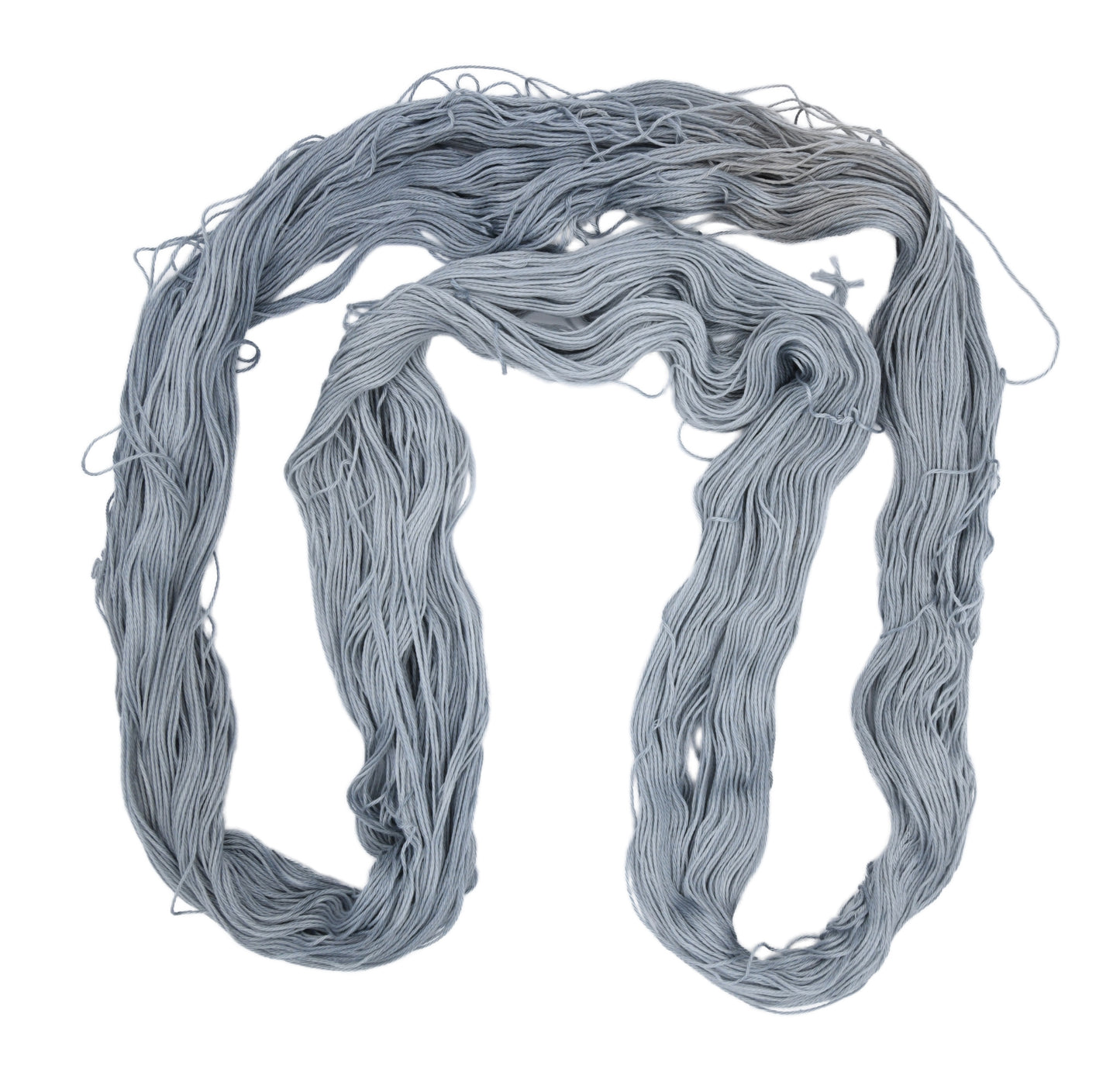 An unfolded skein of Barn Yarn Hand-dyed fingering weight yarn in colorway I Slate a Dragon! — 100% recycled cotton in a soft light gray tone, highlighting its smooth 4-ply construction and subtle luster.
