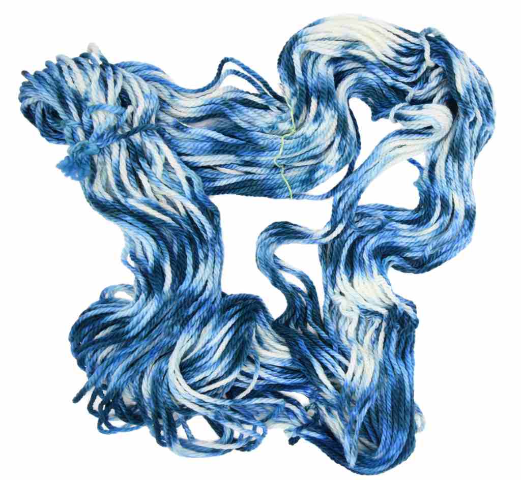 Barn Yarn Stargazing bulky weight hand-dyed yarn—unfolded hank in cream and deep blue tones inspired by a clear night sky with rich tonal variation.