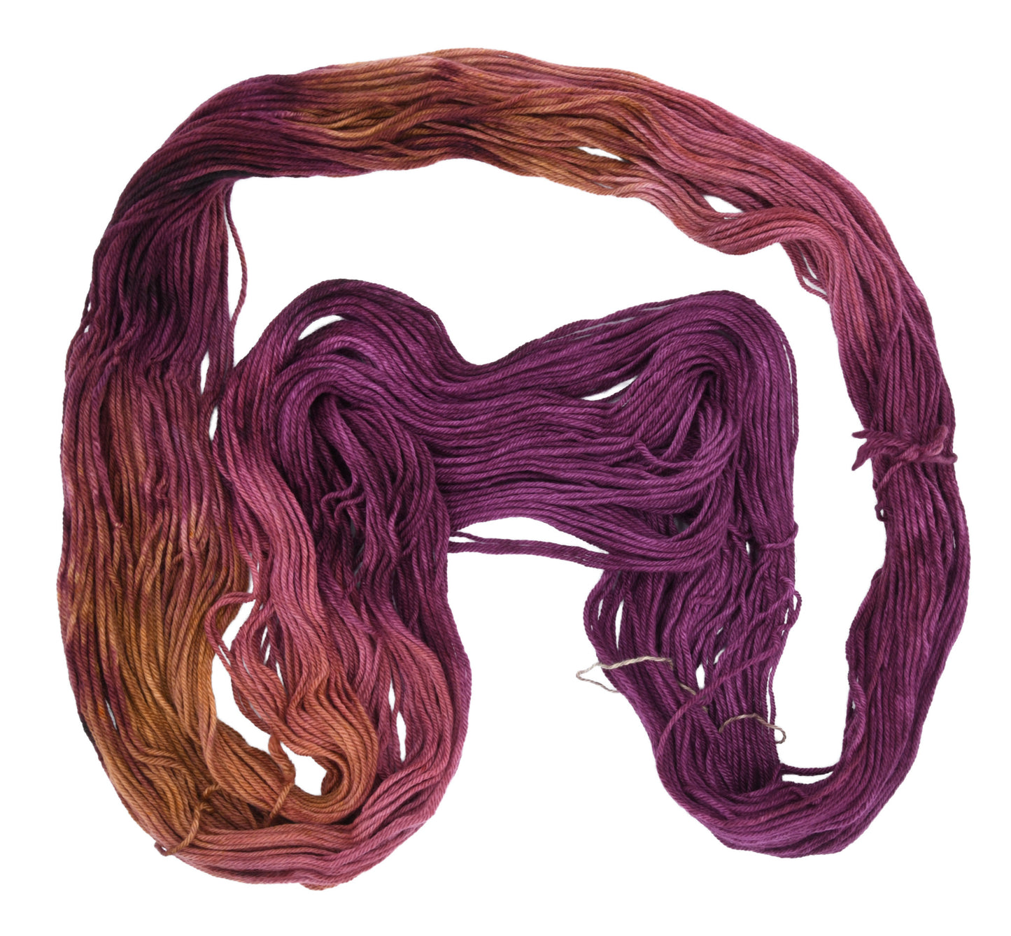 Barn Yarn Sly Fox worsted weight hand-dyed yarn—unfolded hank in burgundy and toffee tones with rich autumnal variation inspired by nature and wild woodland color.