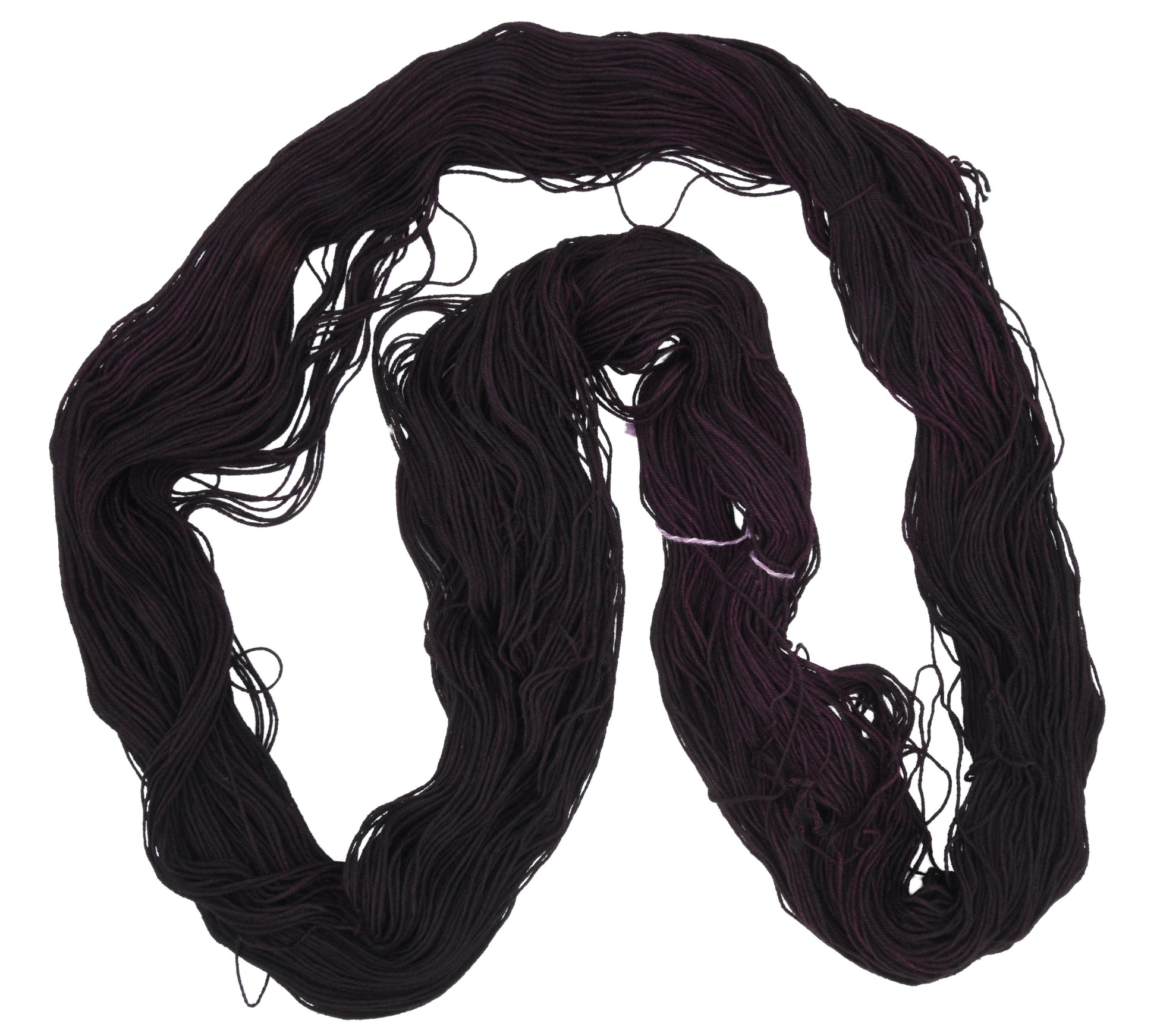 Barn Yarn unfolded skein of Shiraz fingering weight hand-dyed yarn in a deep, dark burgundy, ideal for knitting and crochet projects needing rich, wine-inspired color.