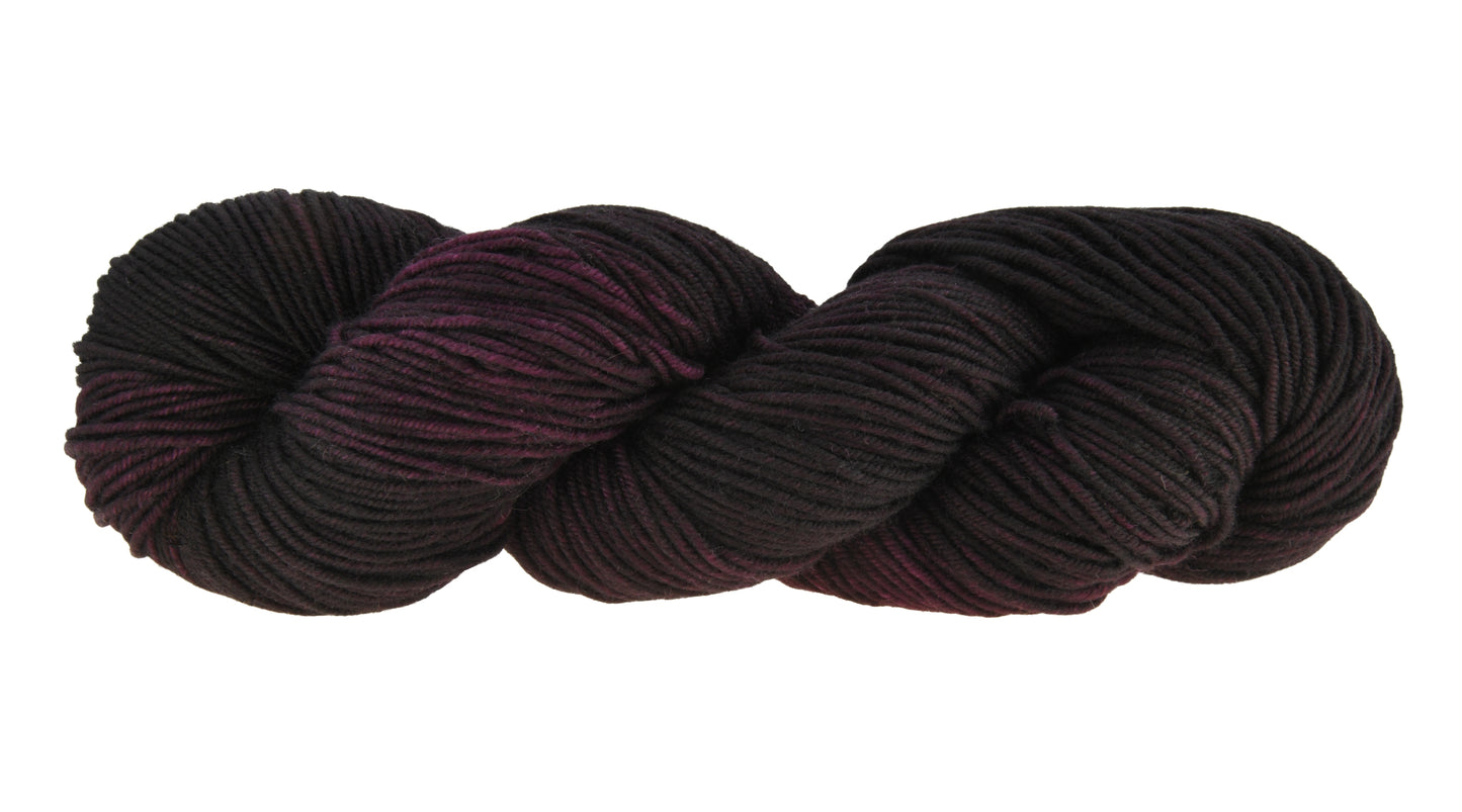 Barn Yarn twisted skein of Shiraz sport weight hand-dyed yarn in a deep, dark burgundy, ideal for knitting and crochet projects needing rich, wine-inspired color.