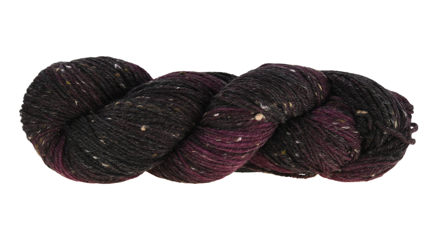 Barn Yarn twisted skein of Shiraz tweed DK weight hand-dyed yarn in a deep, dark burgundy, ideal for knitting and crochet projects needing rich, wine-inspired color.