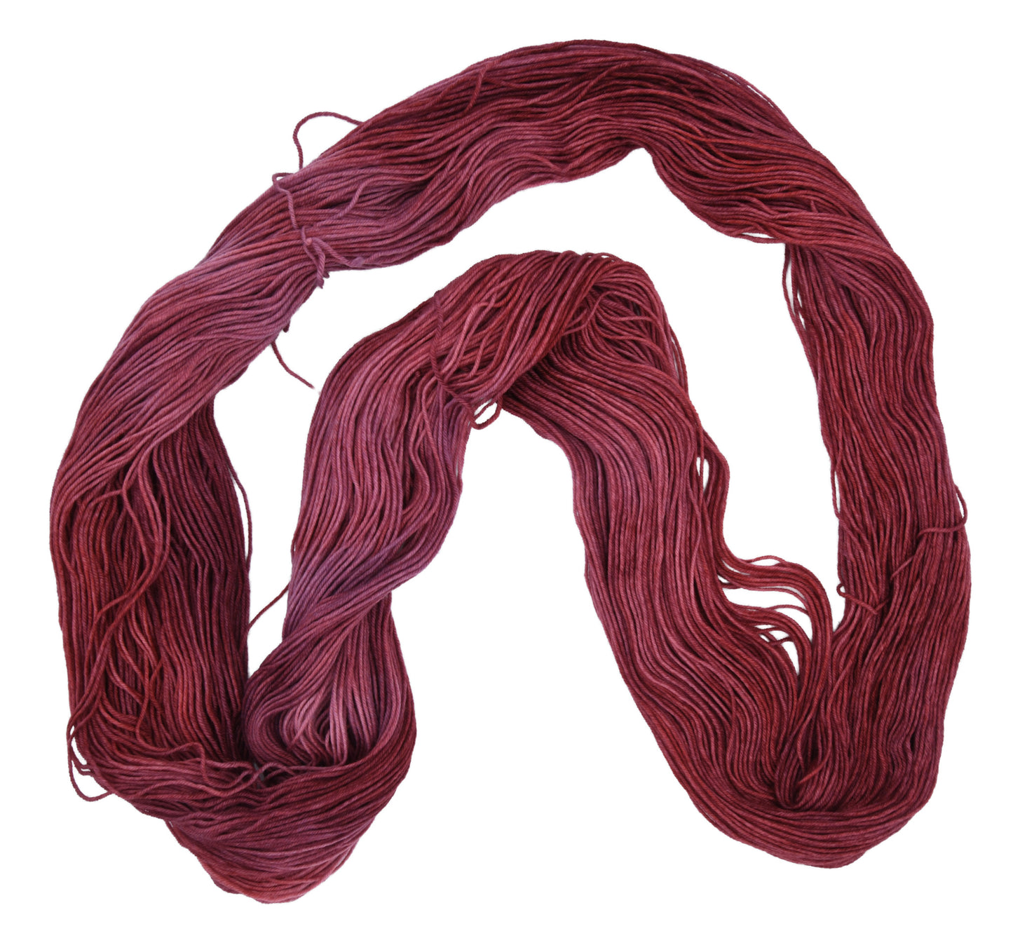 Unfolded hank of Wine Rose fingering weight yarn — richly dyed in a romantic dark rose color, showcasing the depth and tonal variation of the hand-dyed fiber.