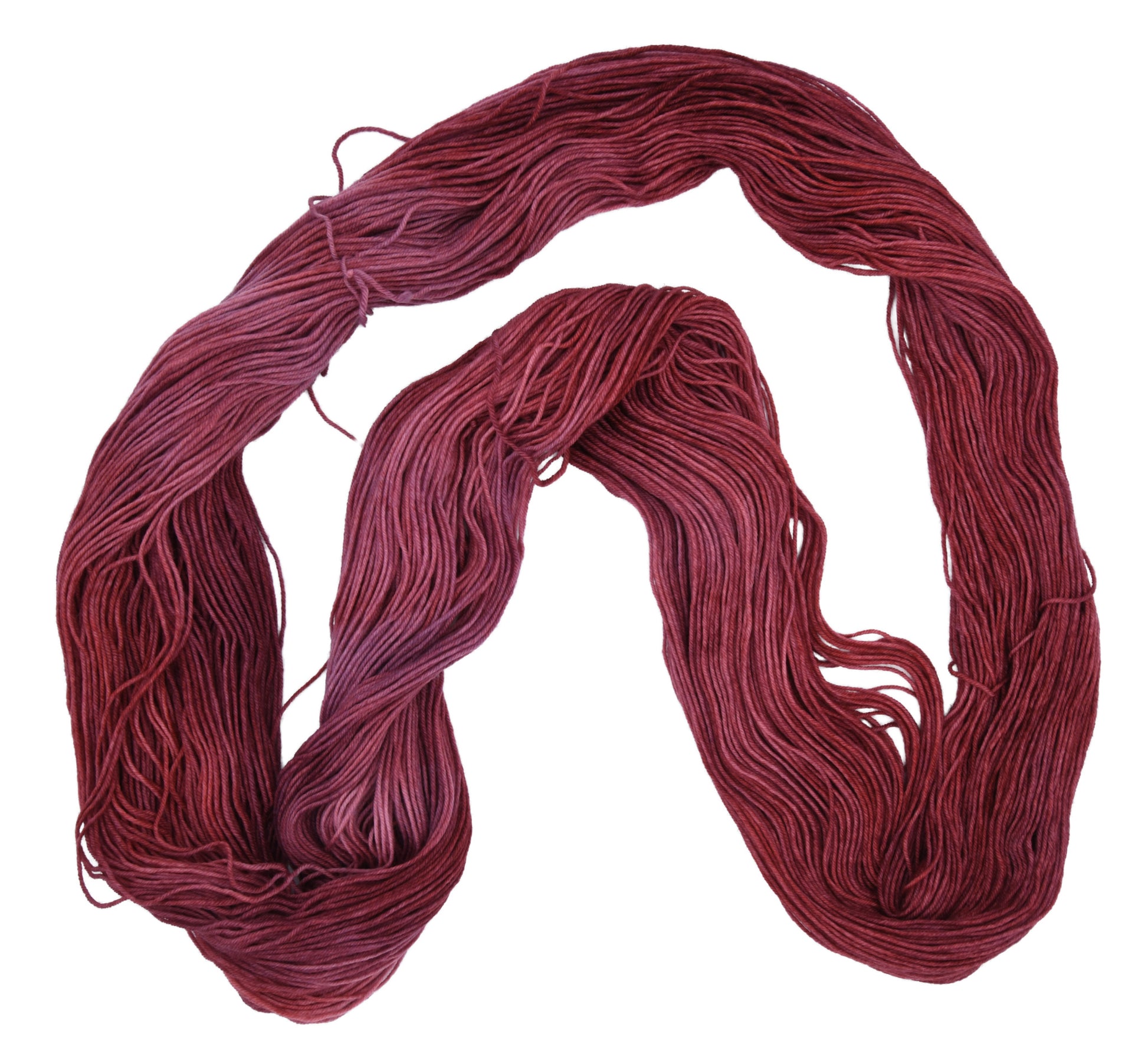 Unfolded hank of Wine Rose fingering weight yarn — richly dyed in a romantic dark rose color, showcasing the depth and tonal variation of the hand-dyed fiber.