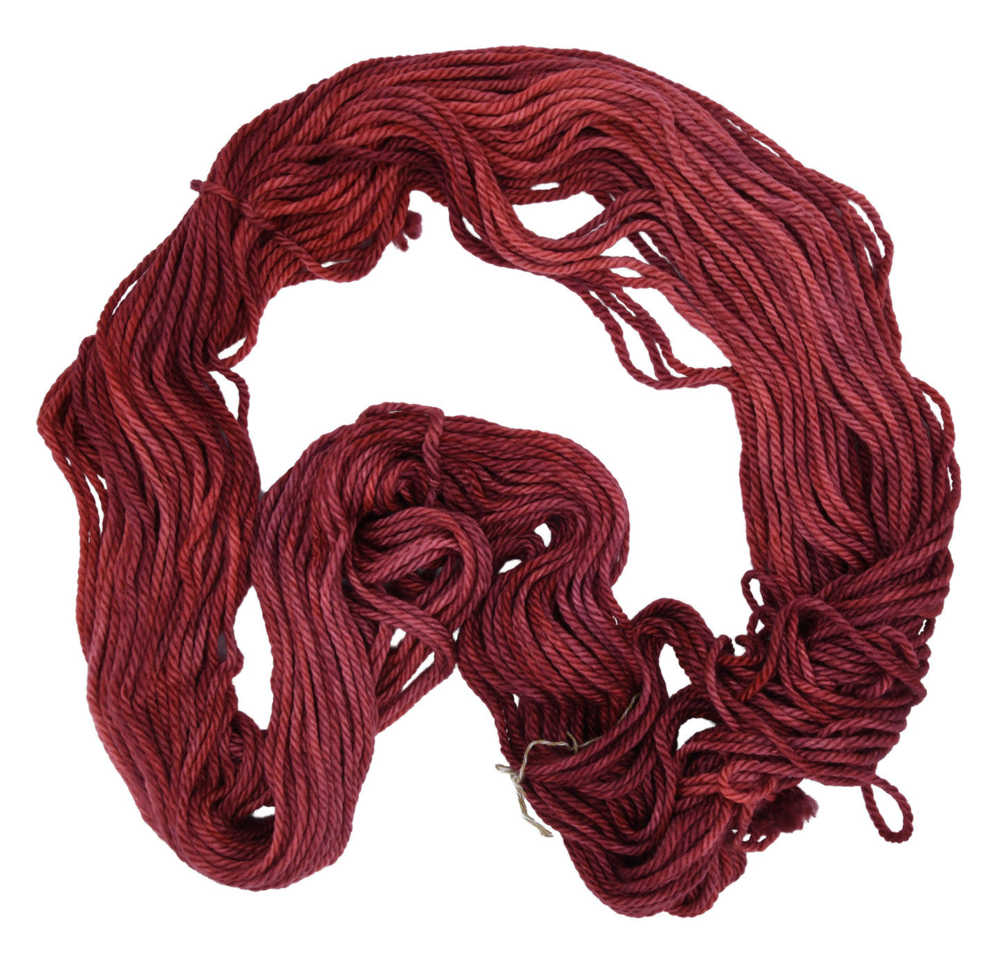 Unfolded hank of Wine Rose bulky weight yarn — richly dyed in a romantic dark rose color, showcasing the depth and tonal variation of the hand-dyed fiber.
