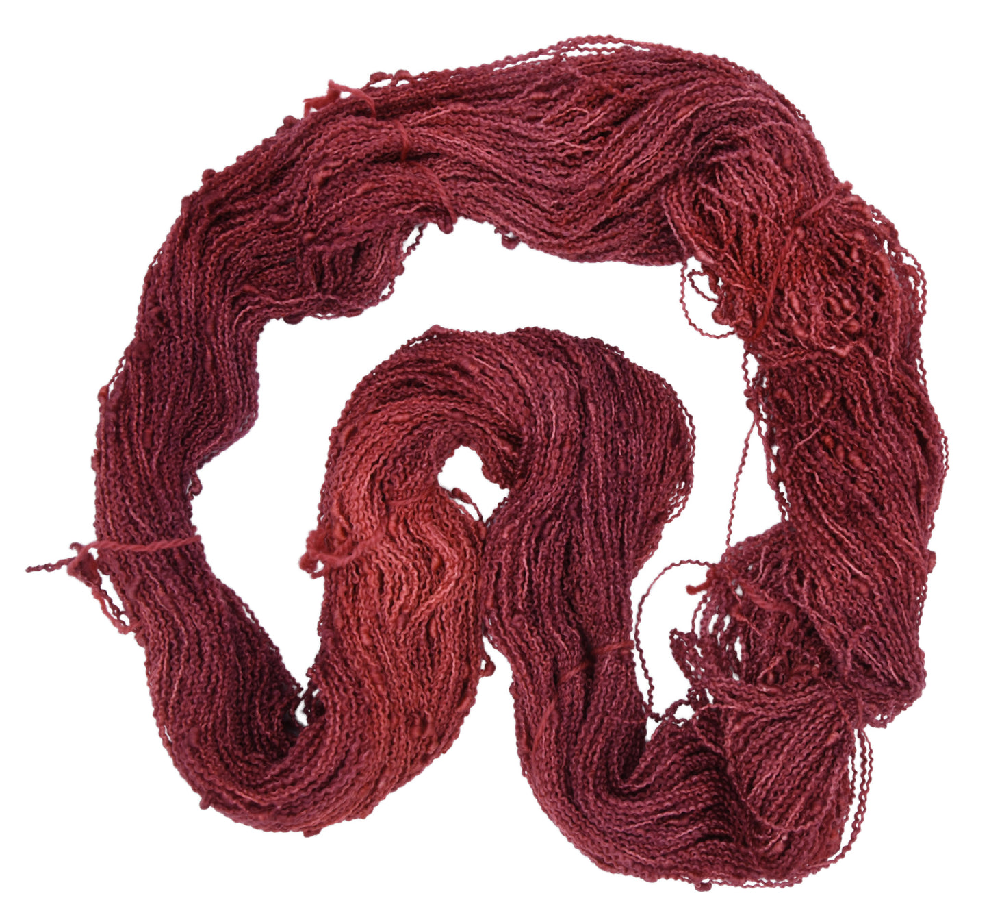 Unfolded hank of Wine Rose slub yarn — richly dyed in a romantic dark rose color, showcasing the depth and tonal variation of the hand-dyed fiber.