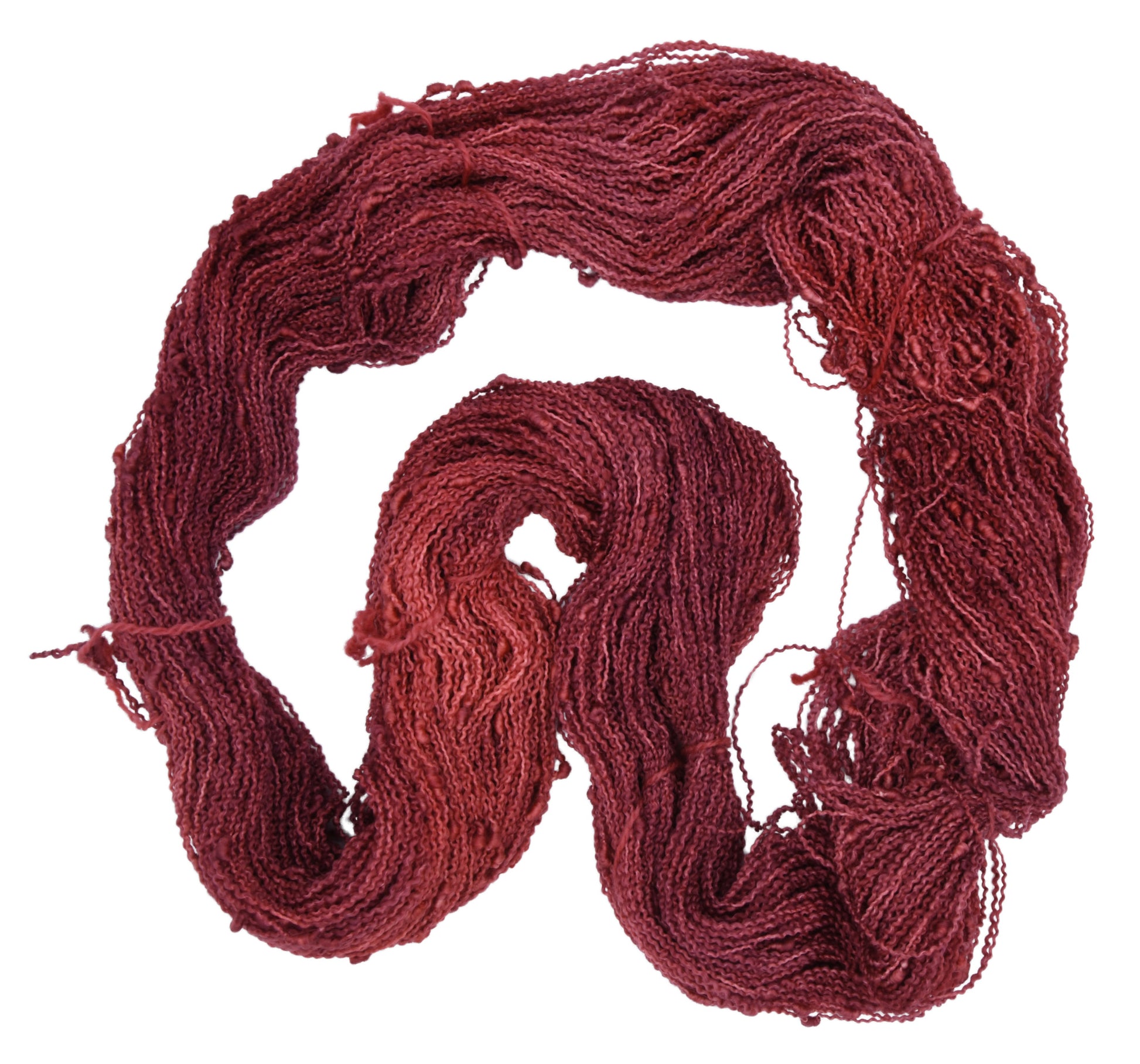 Unfolded hank of Wine Rose slub yarn — richly dyed in a romantic dark rose color, showcasing the depth and tonal variation of the hand-dyed fiber.