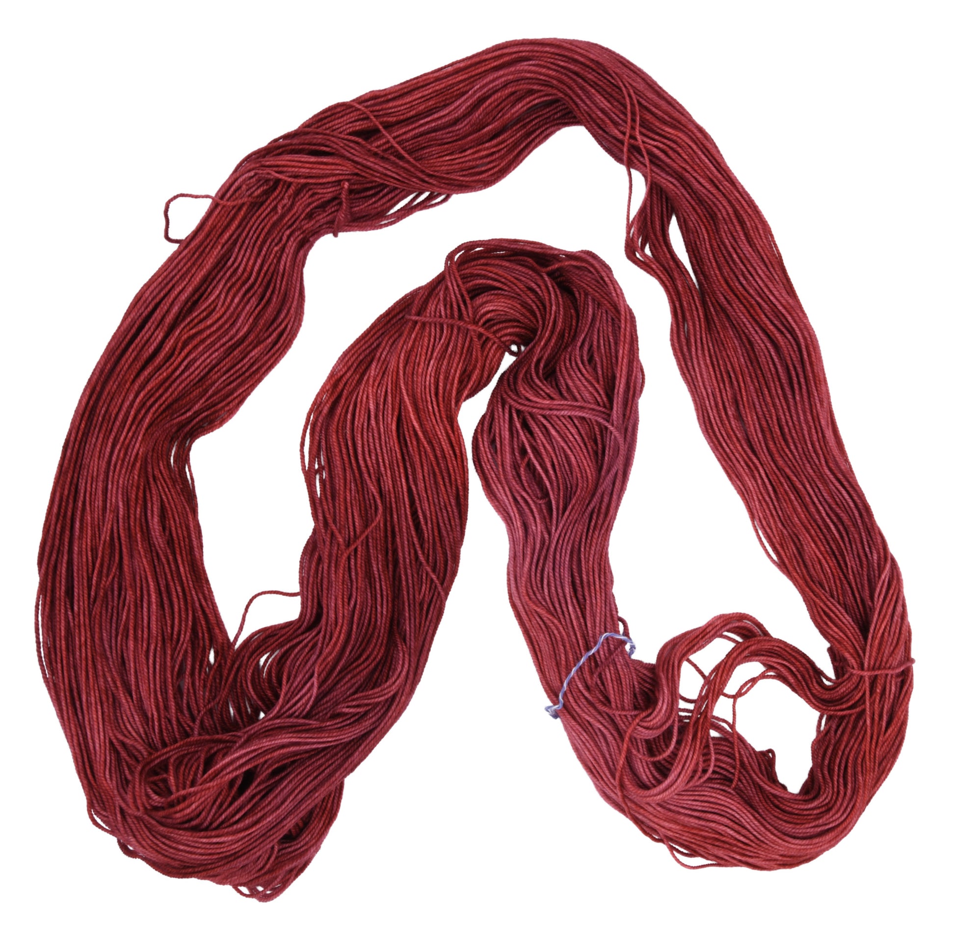 Unfolded hank of Wine Rose sport weight yarn — richly dyed in a romantic dark rose color, showcasing the depth and tonal variation of the hand-dyed fiber.