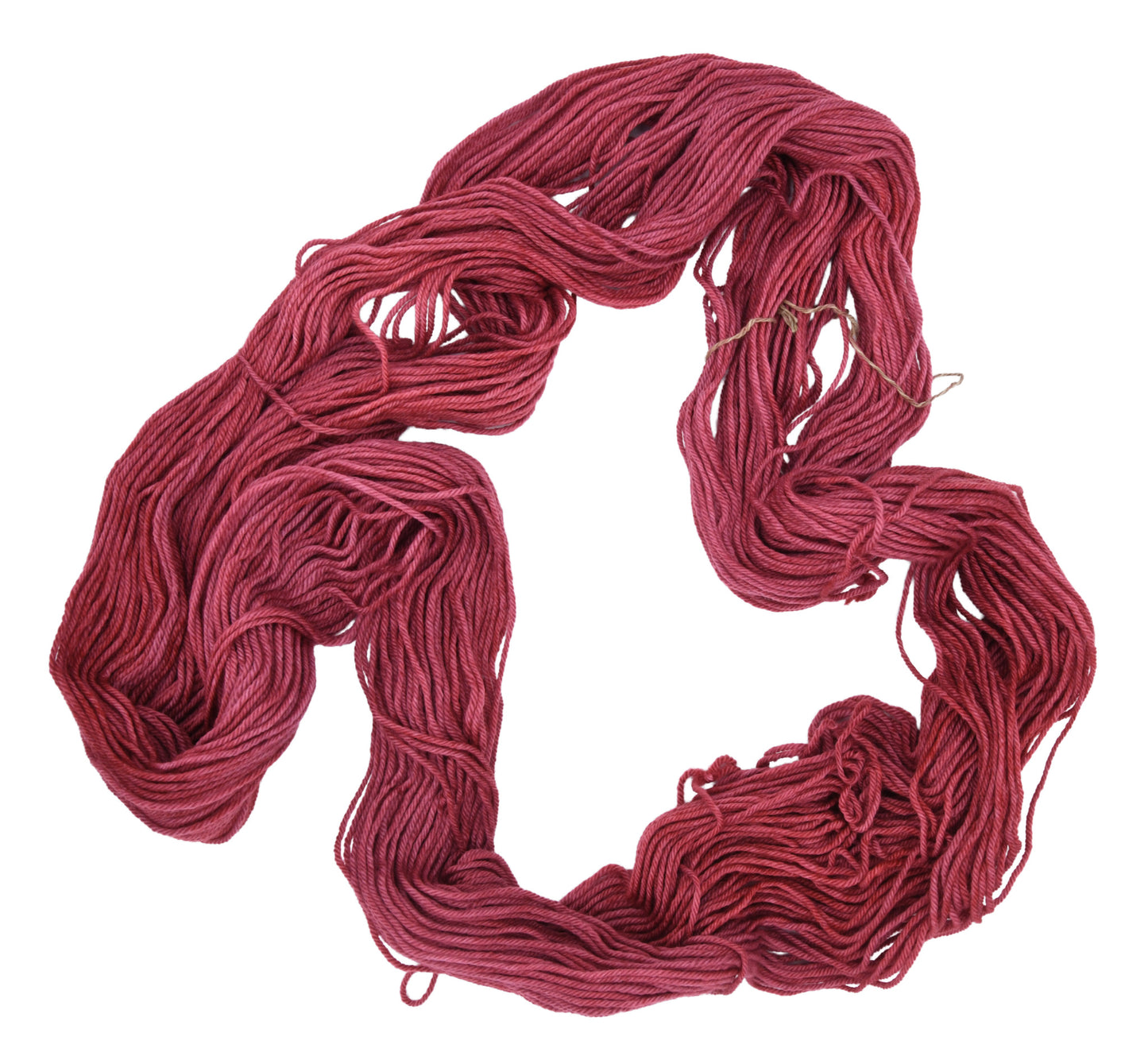 Unfolded hank of Wine Rose worsted weight yarn — richly dyed in a romantic dark rose color, showcasing the depth and tonal variation of the hand-dyed fiber.