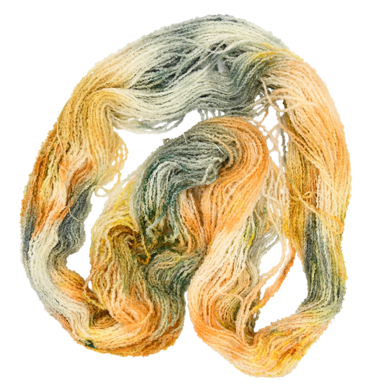 Unfolded hank of Winter Pumpkin Boucle yarn — DK weight 1-ply yarn with a mix of sage, apricot, and golden speckles, highlighting the playful texture and subtle color shifts