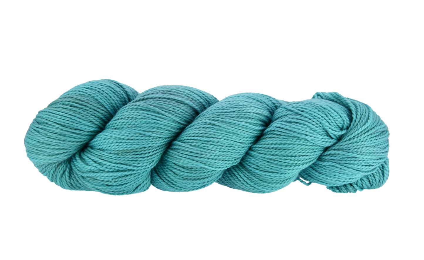 Twisted skein of Barn Yarn hand-dyed 100% cotton DK weight yarn in colorway Teal the Cows Come Home — rich deep teal, perfect for all knit and crochet projects.