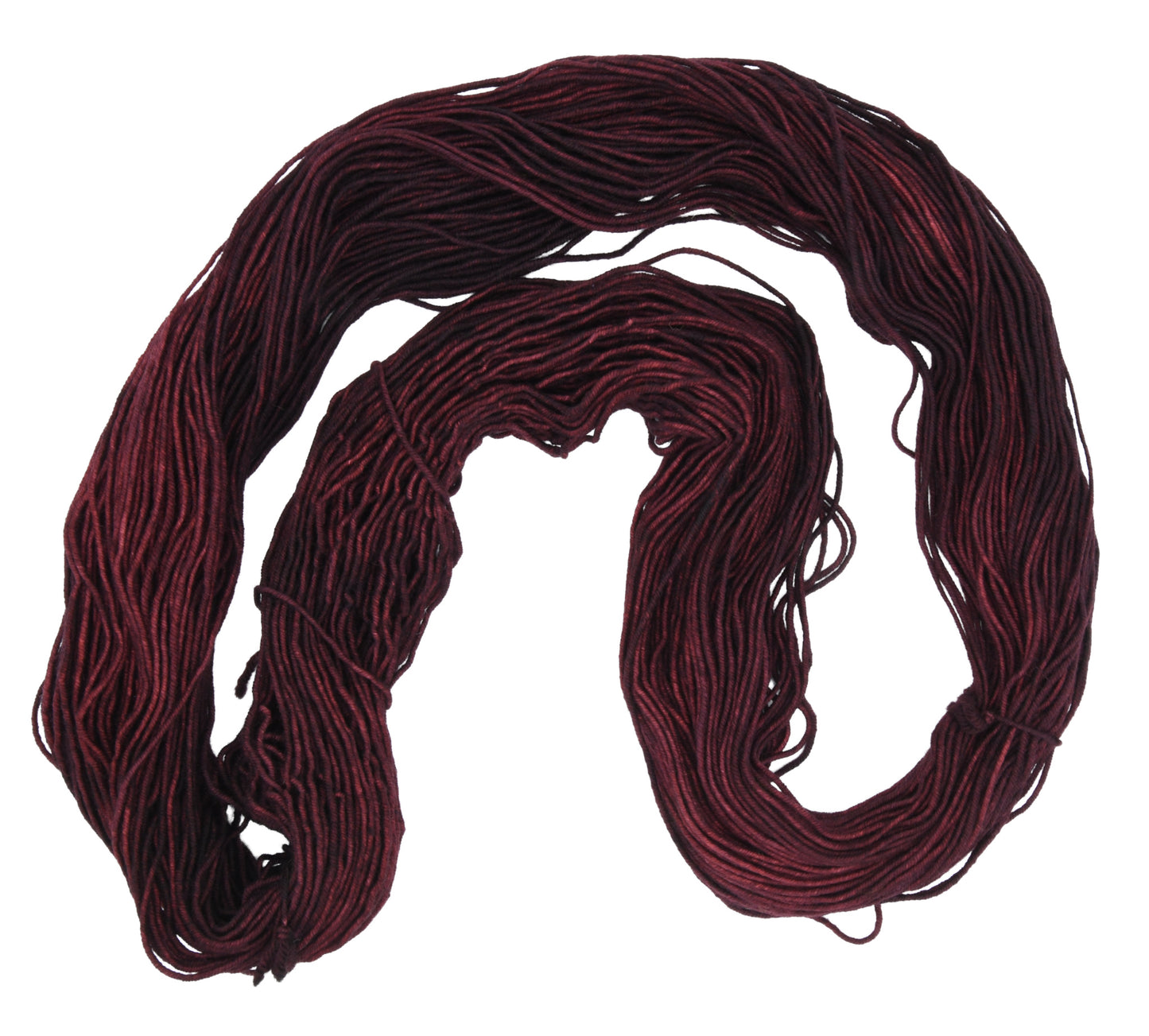 An unfolded skein of Barn Yarn hand-dyed DK weight yarn in colorway Chocolate Moose; a rich, earthy brown shade, perfect for warm and cozy knitting and crochet projects.