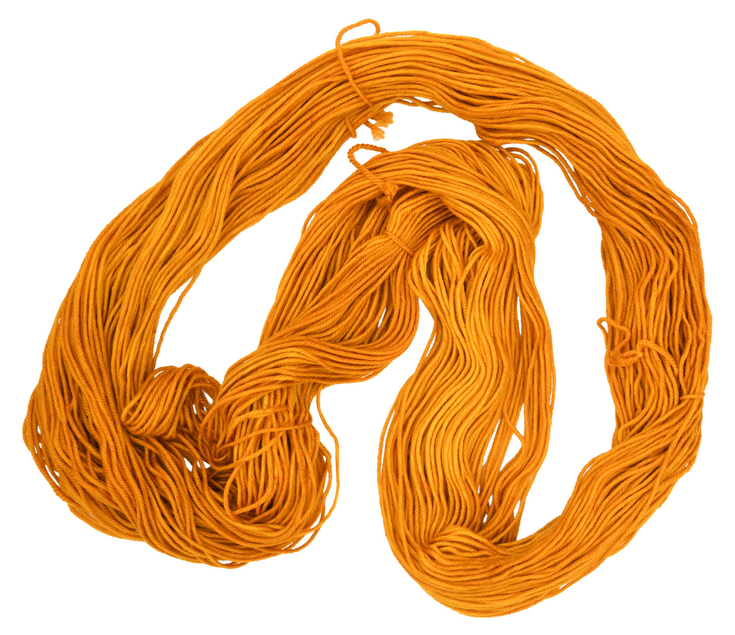 An unfolded skein of Barn Yarn hand-dyed DK weight yarn in colorway Golden Era, a radiant golden yellow shade, perfect for warm and luxurious knitting and crochet projects.