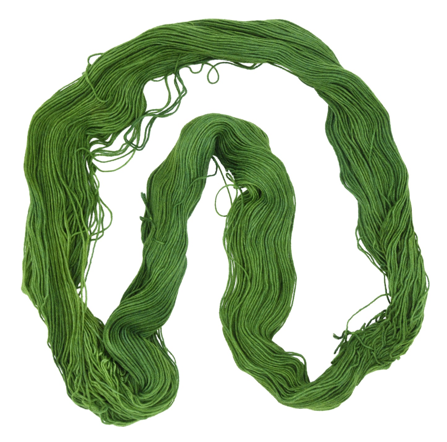 An unfolded skein of Barn Yarn fingering weight yarn in colorway I’m Swamped!; a rich mossy green shade, perfect for earthy knitting and crochet projects.