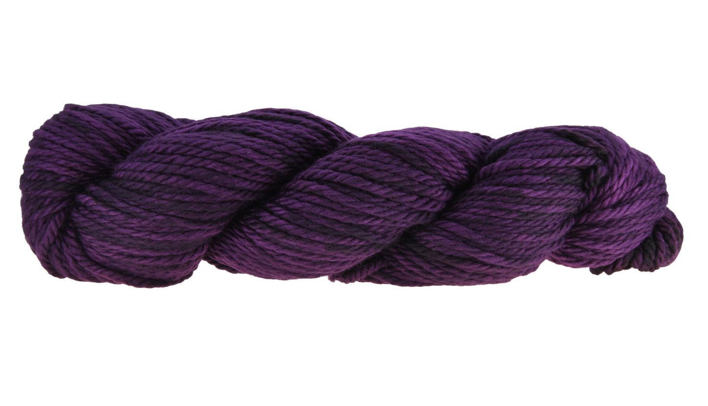 A twisted hank of Barn Yarn hand-dyed bulky weight yarn in colorway Grape-ly Appreciated showing vivid purple tones, ideal for eye-catching knitting and crochet creations.