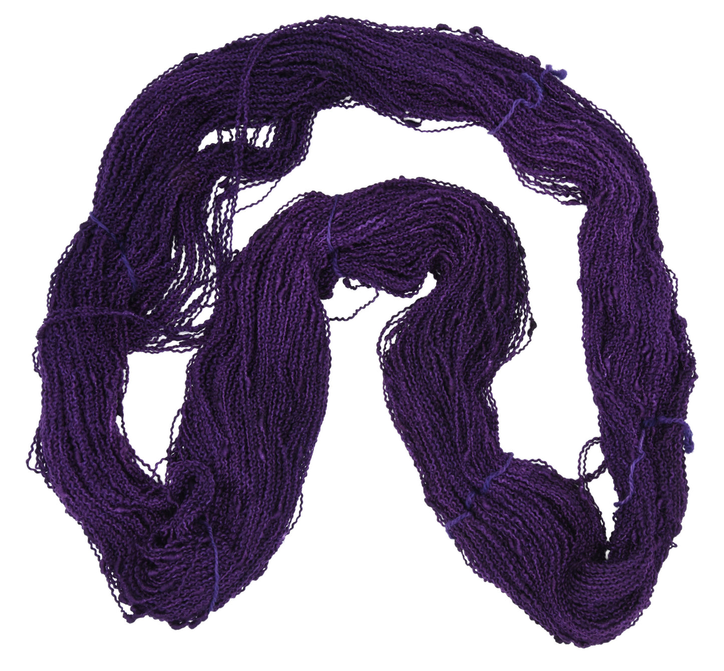 An unfolded hank of Barn Yarn hand-dyed slub yarn in colorway Grape-ly Appreciated showing vivid purple tones, ideal for eye-catching knitting and crochet creations.