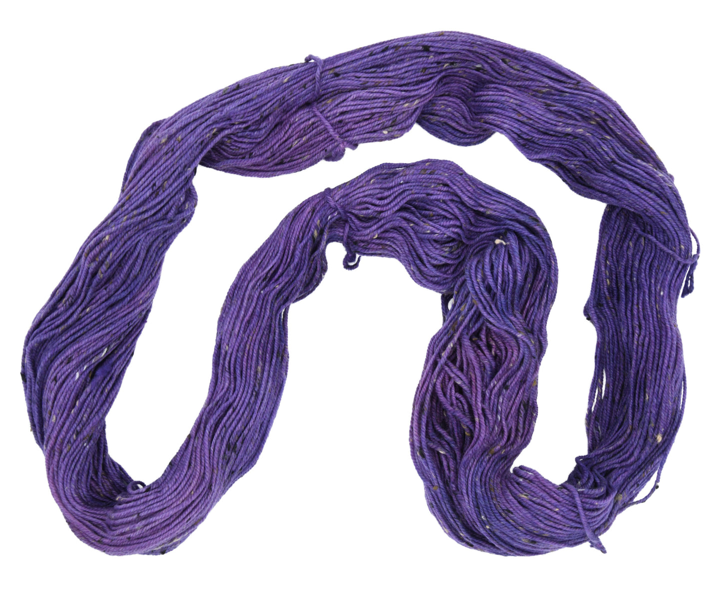 An unfolded hank of Barn Yarn hand-dyed tweed yarn in colorway Grape-ly Appreciated showing vivid purple tones, ideal for eye-catching knitting and crochet creations.