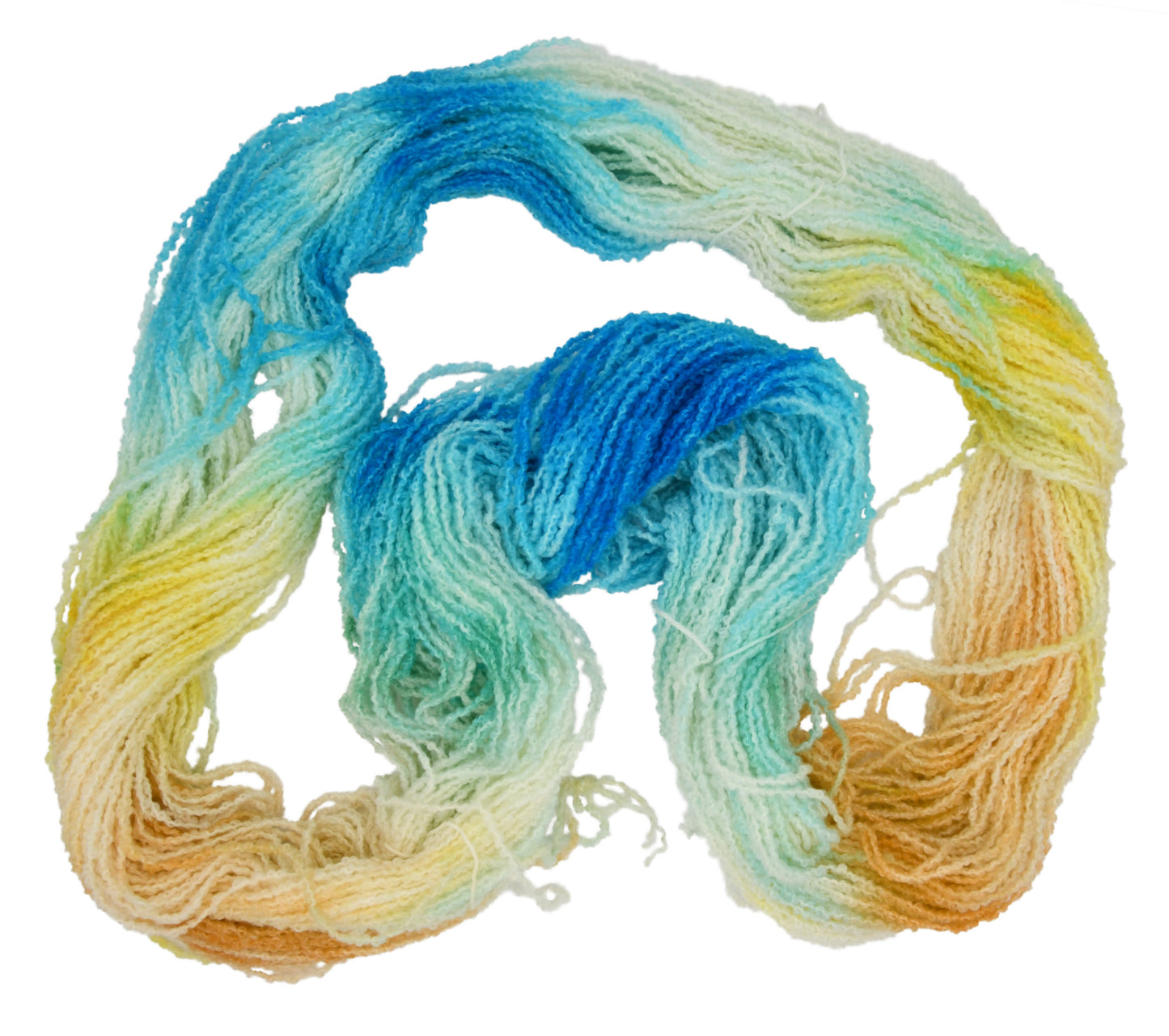 An unfolded skein of Barn Yarn hand-dyed boucle DK weight yarn in colorway Down by the Seaside with breezy blues, sandy neutrals, and sea-glass greens, perfect  knitting and crochet.