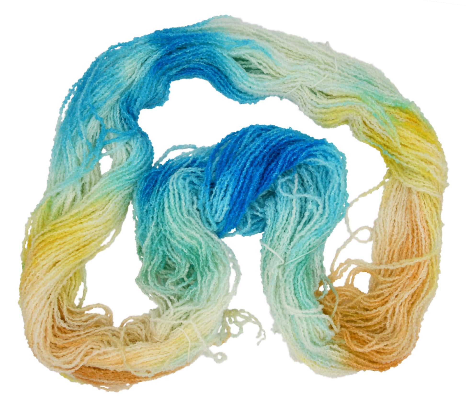 An unfolded skein of Barn Yarn hand-dyed boucle DK weight yarn in colorway Down by the Seaside with breezy blues, sandy neutrals, and sea-glass greens, perfect  knitting and crochet.