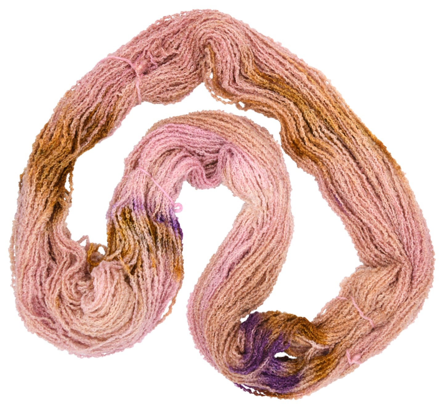 An unfolded skein of Barn Yarn hand-dyed boucle DK weight yarn in colorway Nougat, a light pink, toffee, and purple combination, perfect for knitting and crochet projects.