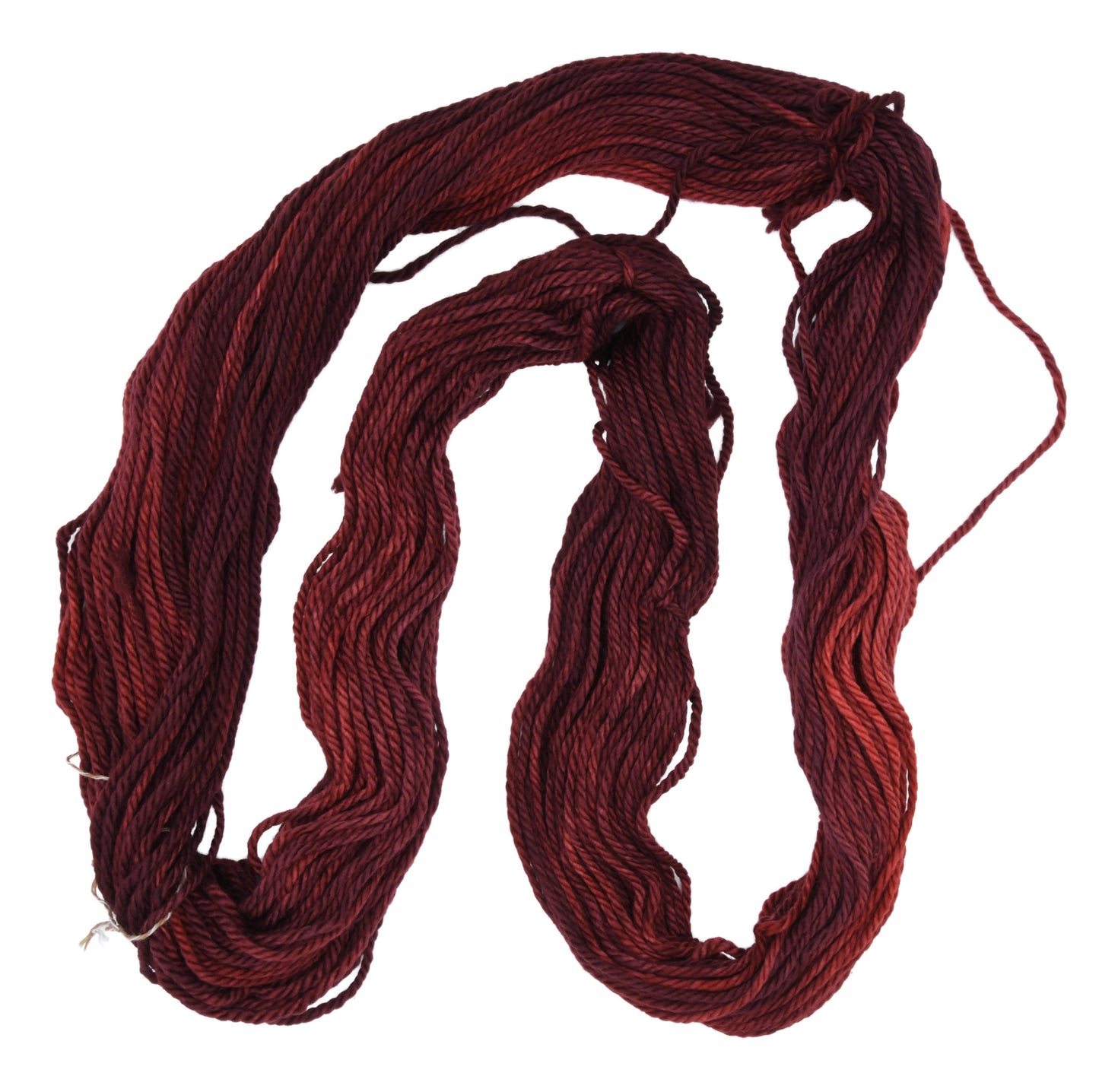 An unfolded skein of Barn Yarn hand-dyed bulky weight yarn in colorway Chocolate Moose; a rich, earthy brown shade, perfect for warm and cozy knitting and crochet projects.