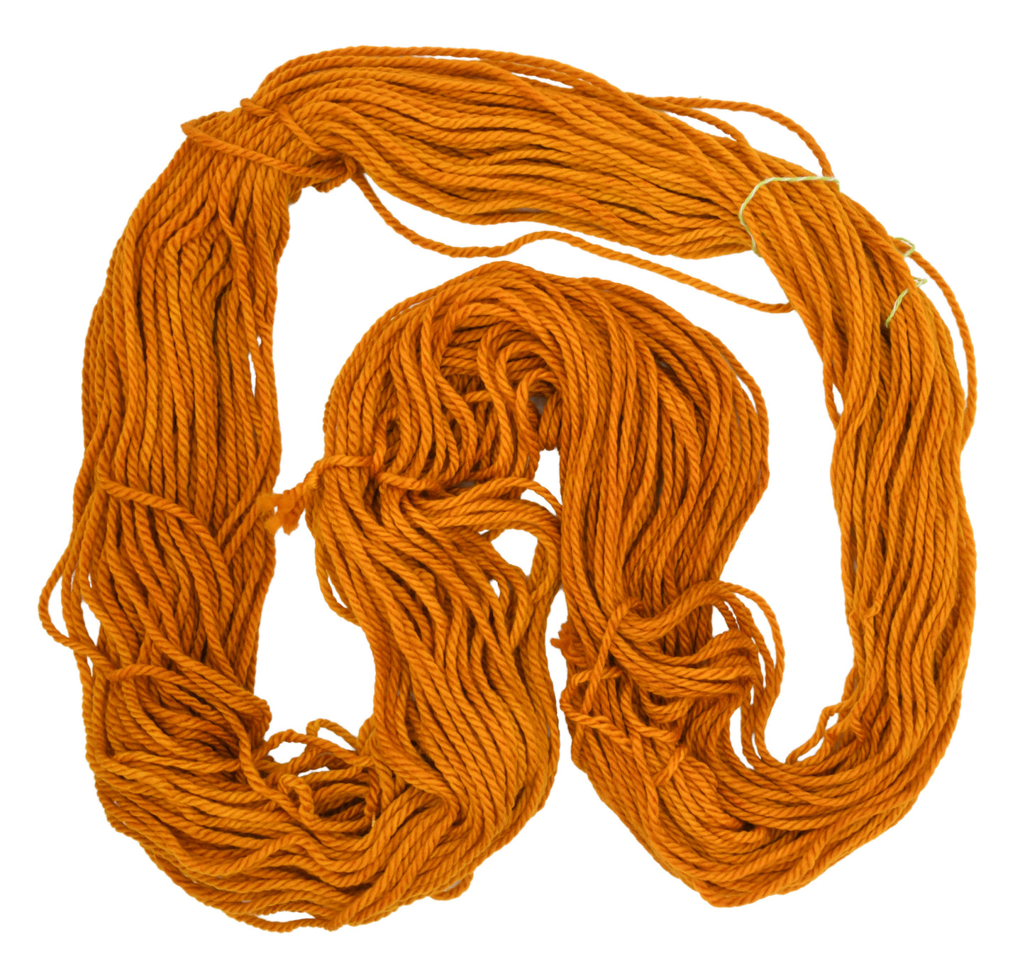An unfolded skein of Barn Yarn hand-dyed bulky weight yarn in colorway Golden Era, a radiant golden yellow shade, perfect for warm and luxurious knitting and crochet projects.