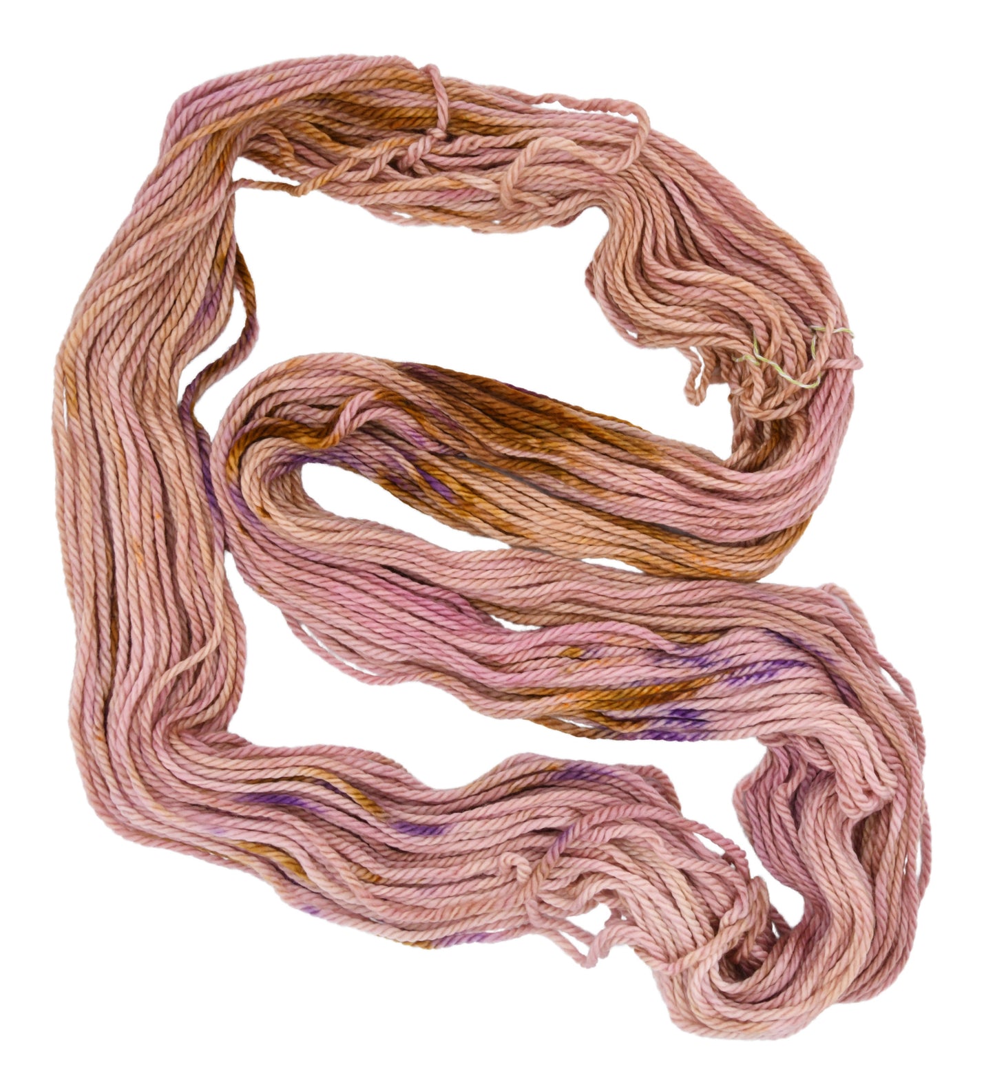 An unfolded skein of Barn Yarn hand-dyed bulky weight yarn in colorway Nougat, a light pink, toffee, and purple combination, perfect for knitting and crochet projects.