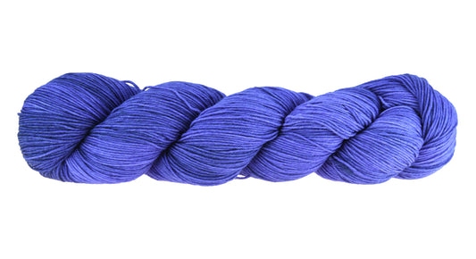 A twisted skein of Barn Yarn fingering weight yarn in colorway Lavender; inspired by the lavender flower, perfect for  knitting and crochet projects.