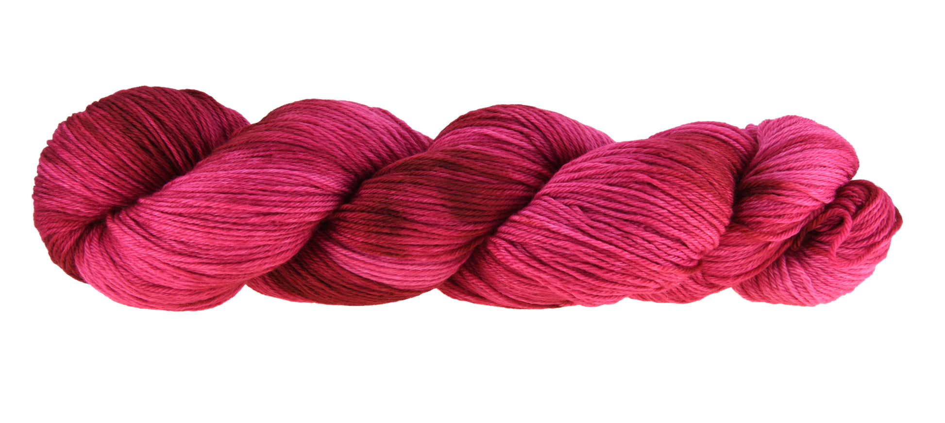 A twisted hank of merino-cashmere-nylon-blend fingering weight hand-dyed yarn in colorway Pomegranate featuring layered bright and dark saturated pink tones, ideal for vibrant handmade creations.