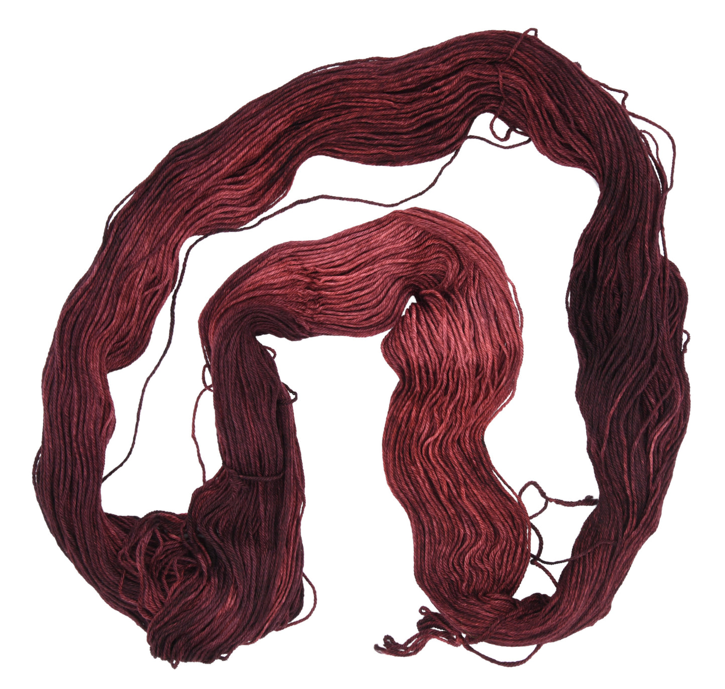 An unfolded skein of Barn Yarn hand-dyed merino-cashmere-nylon yarn in colorway Chocolate Moose; a rich, earthy brown shade, perfect for warm and cozy knitting and crochet projects.