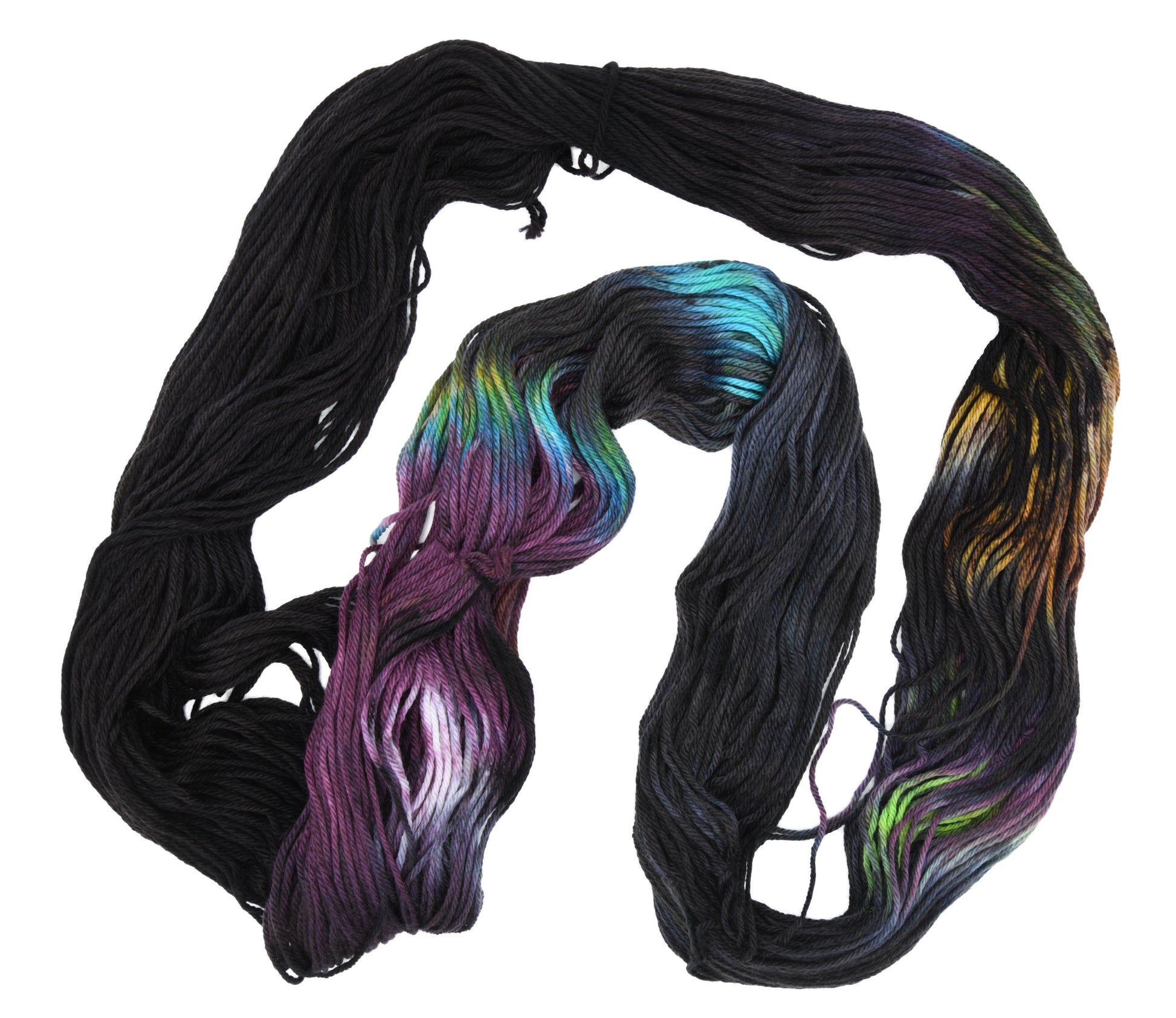 An unfolded skein of Barn Yarn hand-dyed merino-cashmere-nylon yarn in colorway Imperial Pumpkin - a black base layered with pumpkin orange, plum, blue, gray, green, and warm browns. Perfect for knitting and crochet projects.