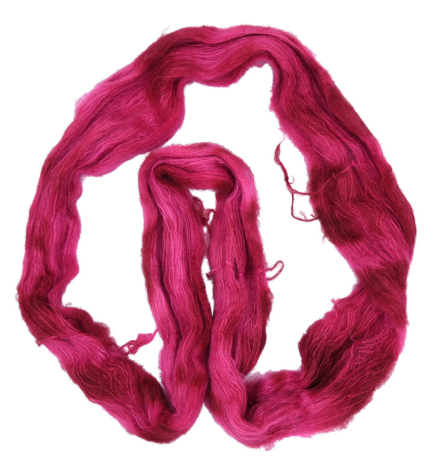 An unfolded hank of mohair hand-dyed yarn in colorway Pomegranate featuring layered bright and dark saturated pink tones, ideal for vibrant handmade creations.