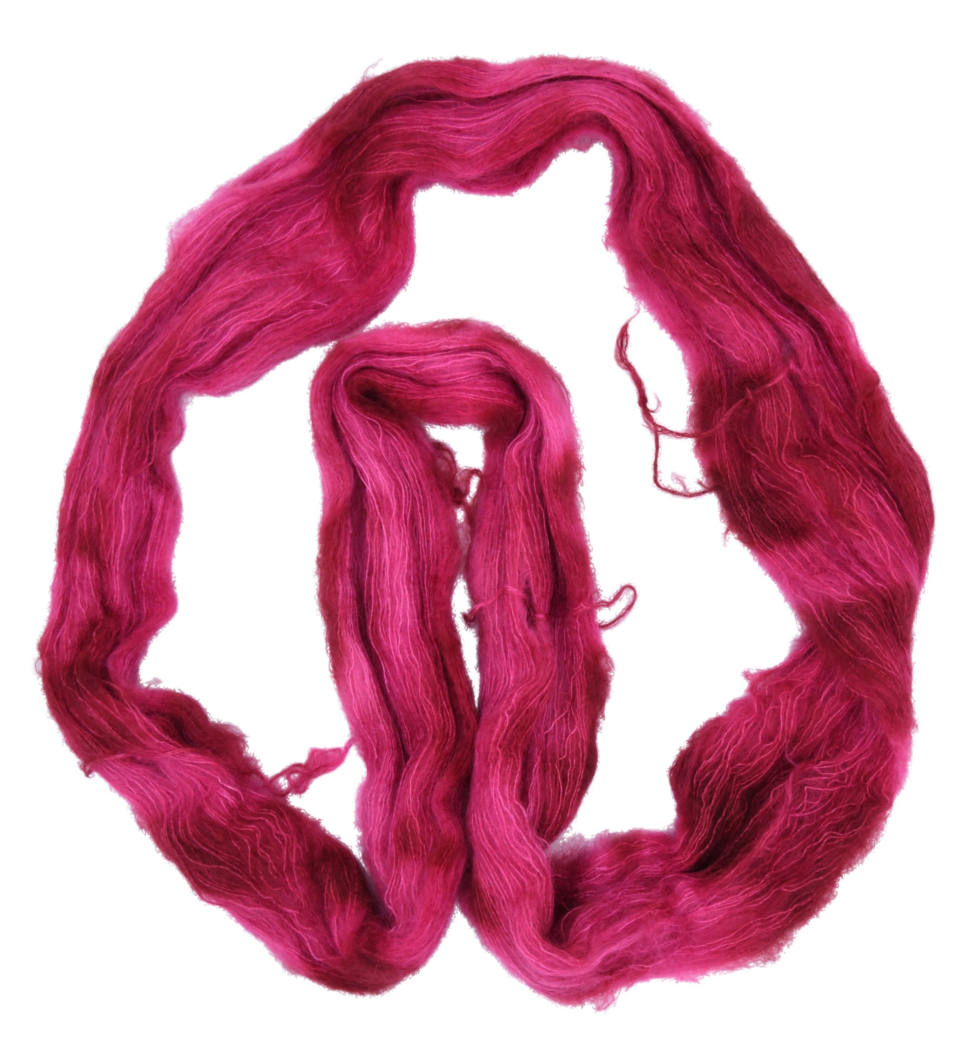 An unfolded hank of mohair hand-dyed yarn in colorway Pomegranate featuring layered bright and dark saturated pink tones, ideal for vibrant handmade creations.