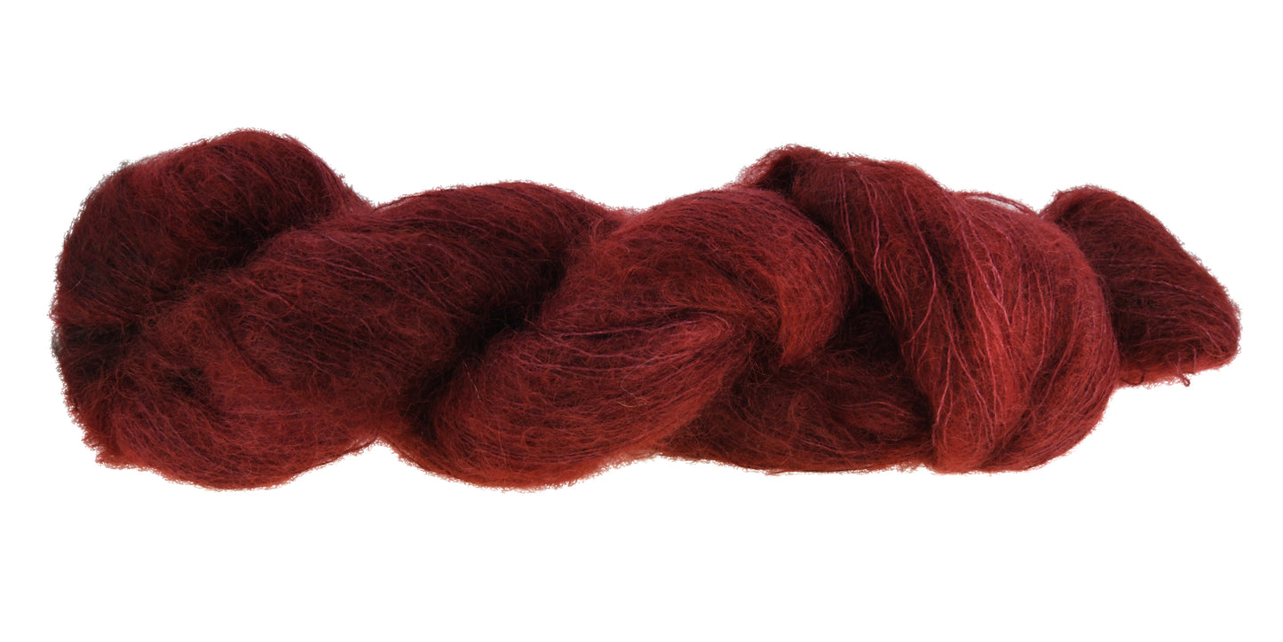 A twisted skein of Barn Yarn hand-dyed mohair yarn in colorway Chocolate Moose; a rich, earthy brown shade, perfect for warm and cozy knitting and crochet projects.