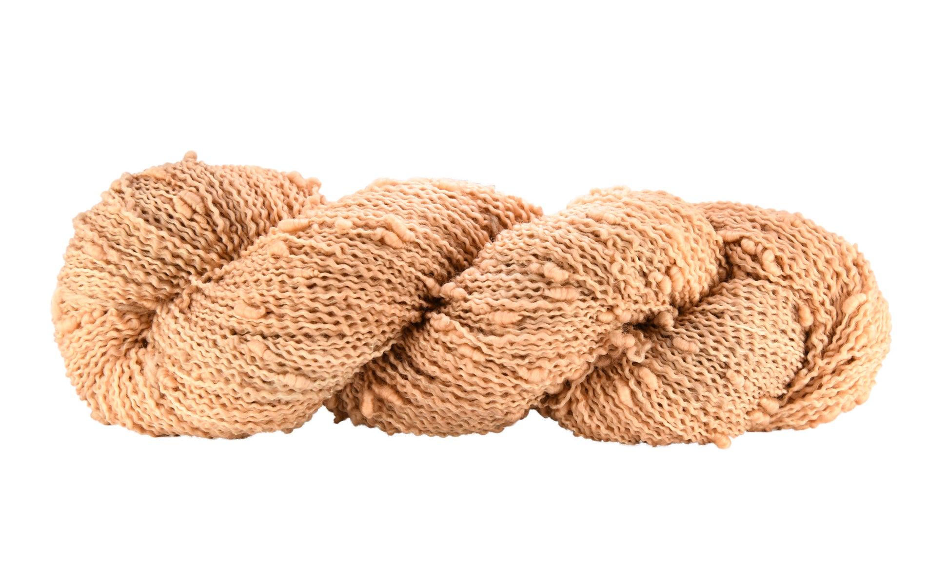 A twisted skein of Barn Yarn hand-dyed slub yarn in colorway Pink Sand, a soft blush pink with sandy undertones, perfect for knitting and crochet projects.