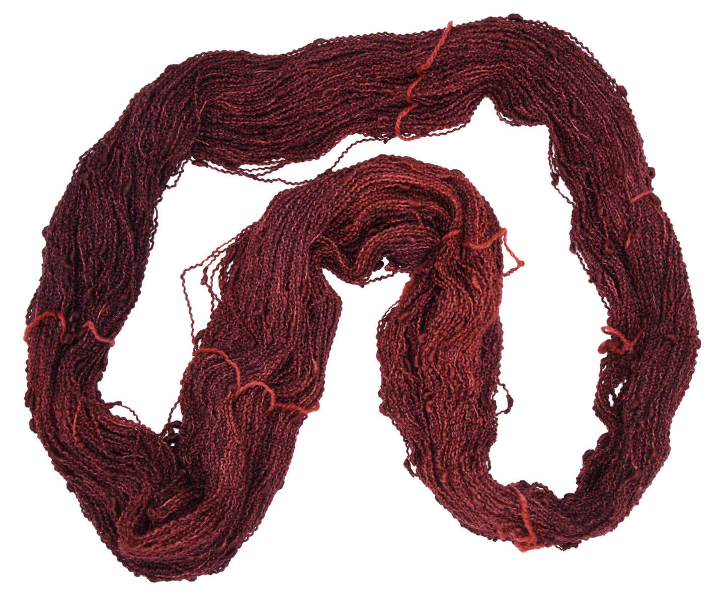 An unfolded skein of Barn Yarn hand-dyed slub yarn in colorway Chocolate Moose; a rich, earthy brown shade, perfect for warm and cozy knitting and crochet projects.