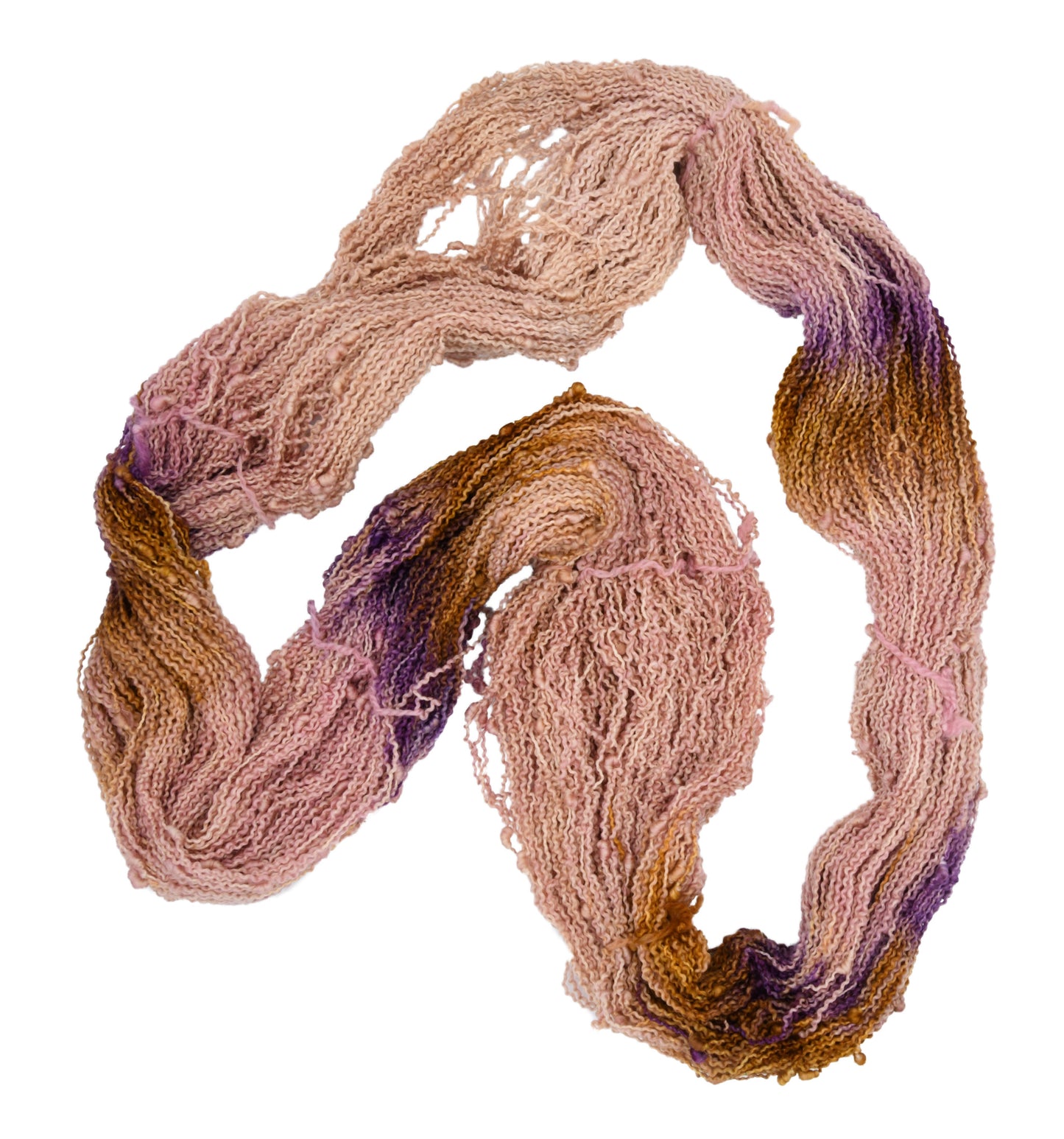 An unfolded skein of Barn Yarn hand-dyed slub yarn in colorway Nougat, a light pink, toffee, and purple combination, perfect for knitting and crochet projects.