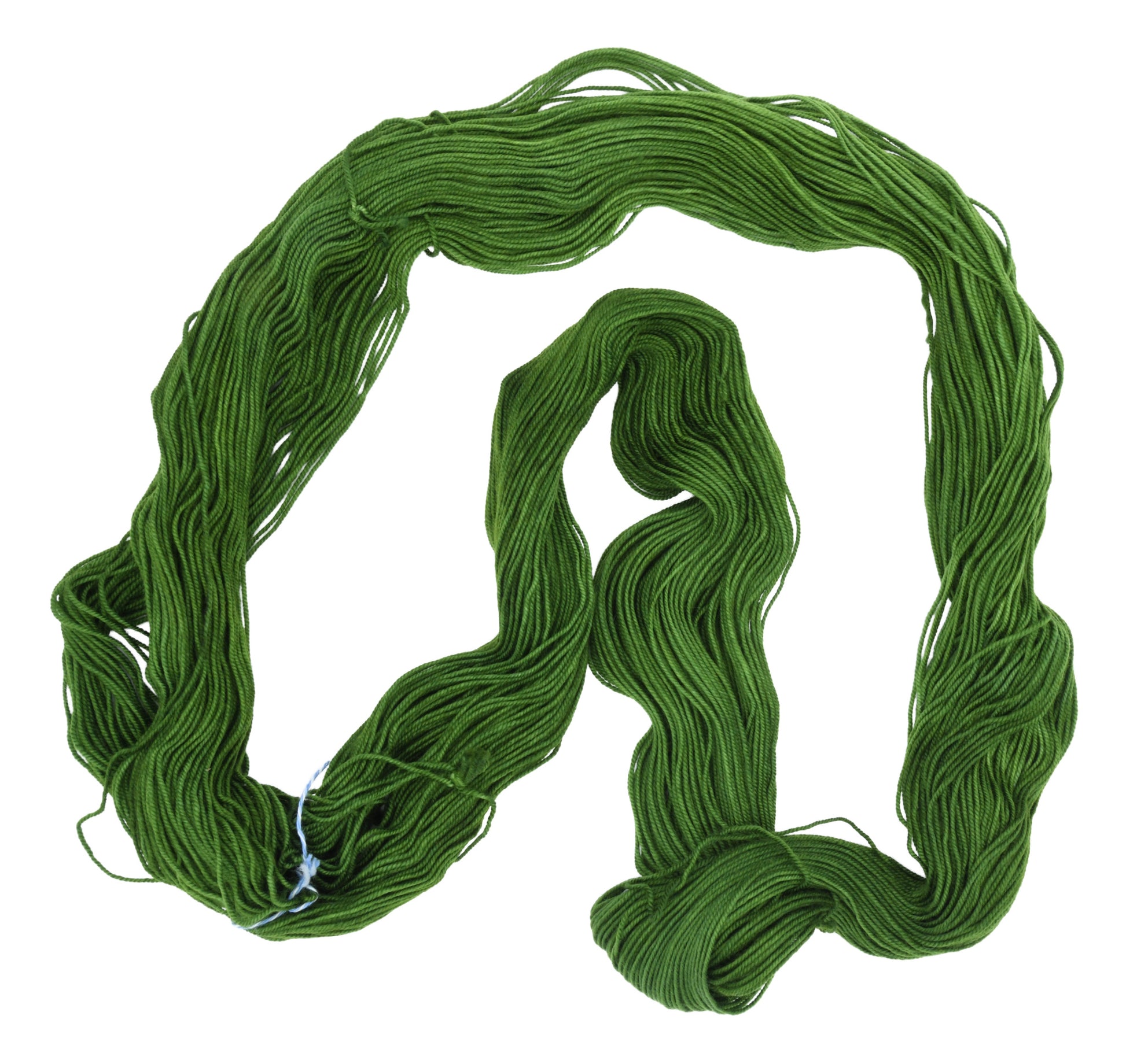 An unfolded skein of Barn Yarn sport weight yarn in colorway I’m Swamped!; a rich mossy green shade, perfect for earthy knitting and crochet projects.