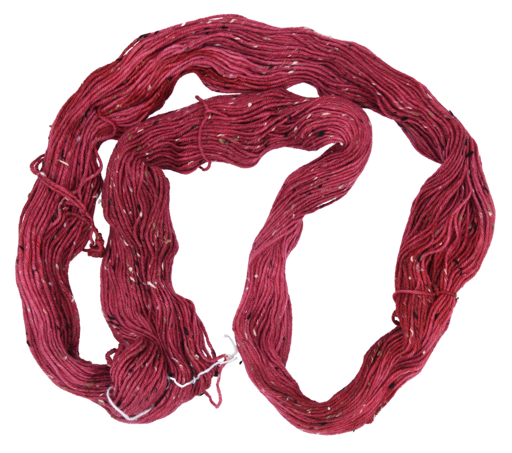 an unfolded hank of tweed DK weight hand-dyed yarn in colorway Pomegranate featuring layered bright and dark saturated pink tones, ideal for vibrant handmade creations.