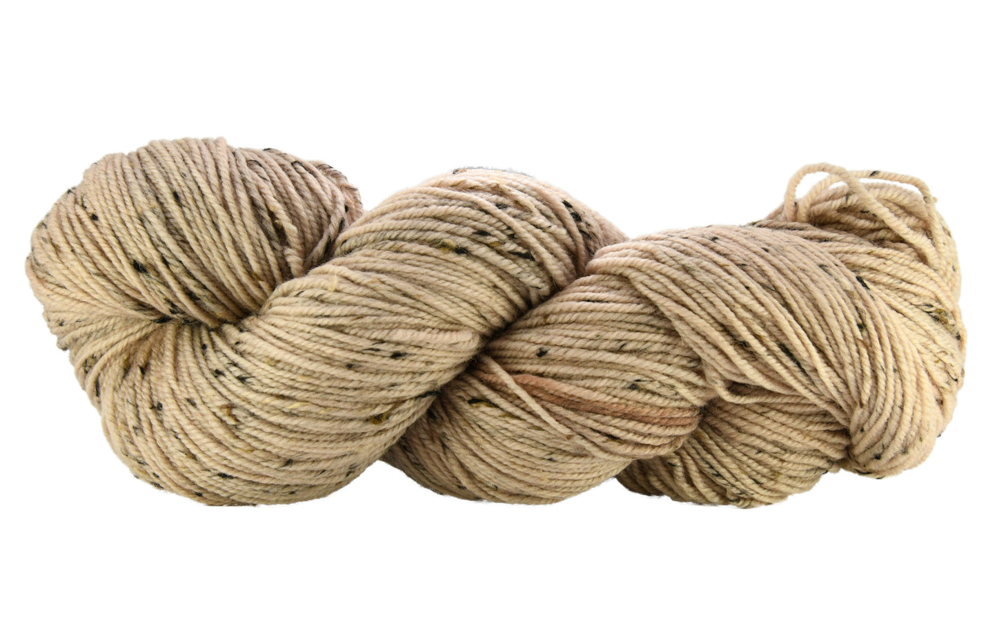 A twisted skein of Barn Yarn hand-dyed tweed DK weight yarn in colorway Pink Sand, a soft blush pink with sandy undertones, perfect for knitting and crochet projects.