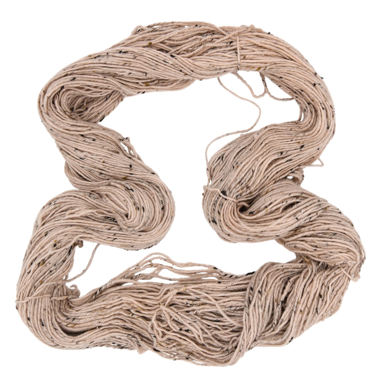 An unfolded skein of Barn Yarn hand-dyed tweed DK weight yarn in colorway Pink Sand, a soft blush pink with sandy undertones, perfect for knitting and crochet projects.