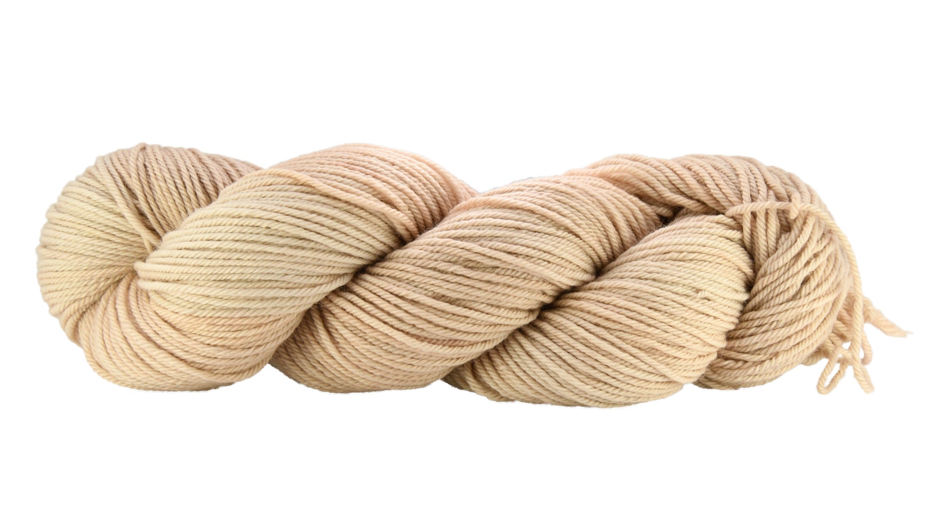 A twisted skein of Barn Yarn hand-dyed worsted weight yarn in colorway Pink Sand, a soft blush pink with sandy undertones, perfect for knitting and crochet projects.