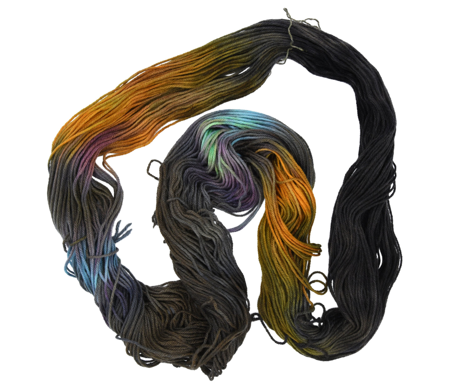 An unfolded skein of Barn Yarn hand-dyed worsted weight yarn in colorway Imperial Pumpkin - a black base layered with pumpkin orange, plum, blue, gray, green, and warm browns. Perfect for knitting and crochet projects.