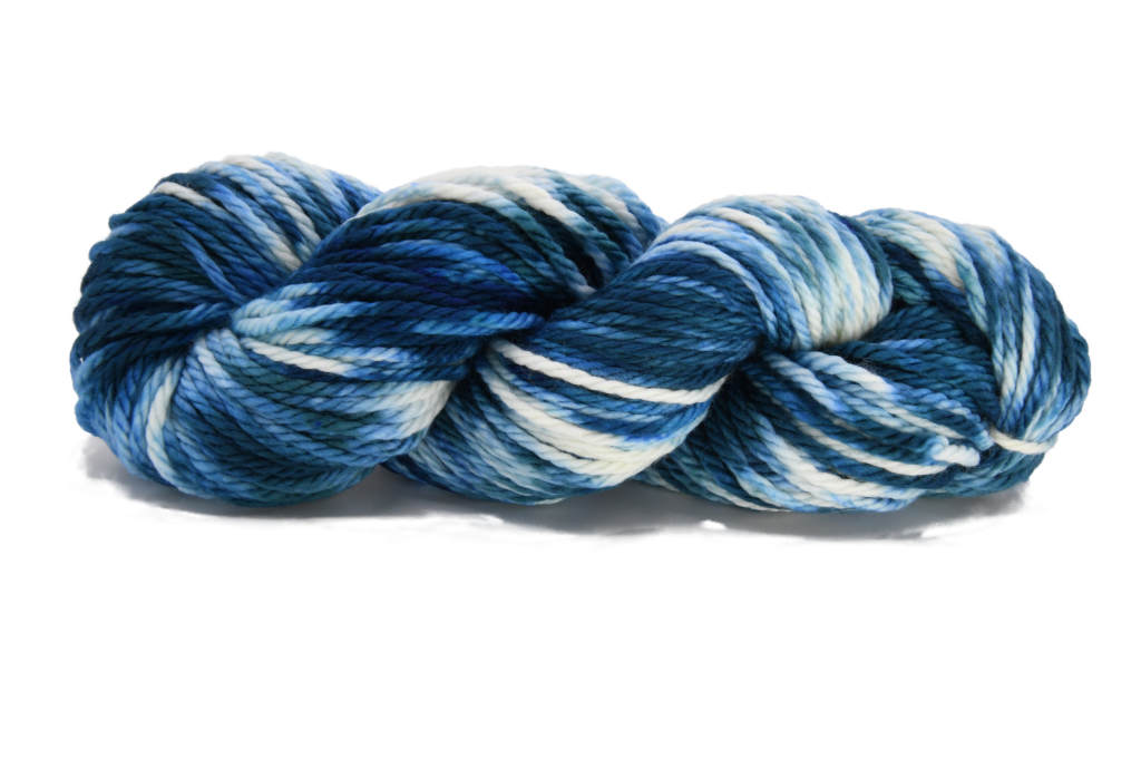 Barn Yarn Stargazing bulky weight hand-dyed yarn—twisted hank in cream and deep blue tones inspired by a clear night sky with rich tonal variation.