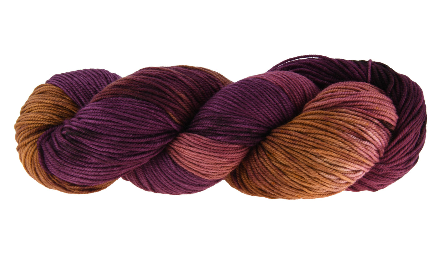 Barn Yarn Sly Fox sport weight hand-dyed yarn—twisted hank in burgundy and toffee tones with rich autumnal variation inspired by nature and wild woodland color.