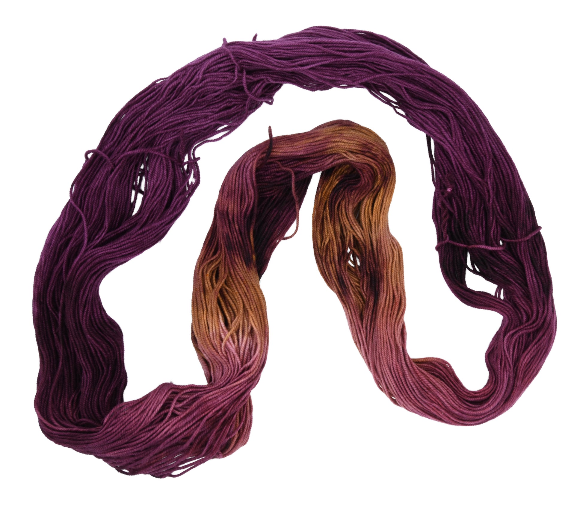 Barn Yarn Sly Fox sport weight hand-dyed yarn—unfolded hank in burgundy and toffee tones with rich autumnal variation inspired by nature and wild woodland color.