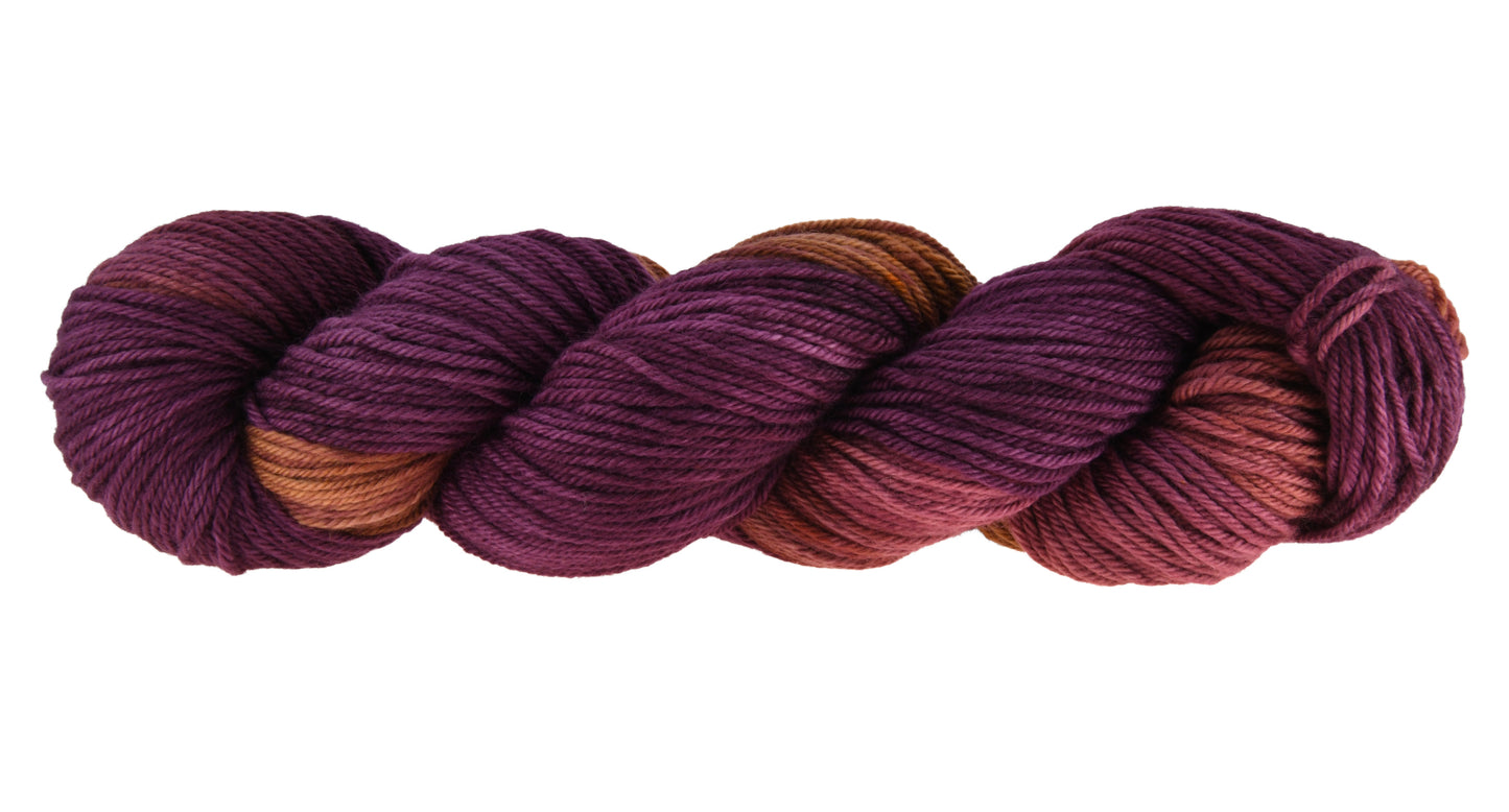 Barn Yarn Sly Fox worsted weight hand-dyed yarn—twisted hank in burgundy and toffee tones with rich autumnal variation inspired by nature and wild woodland color.