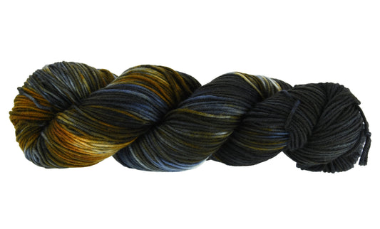 Barn Yarn Tabby Cat sport weight hand-dyed yarn—twisted hank in blended black, toffee, gray and cream ones inspired by tabby cat stripes.